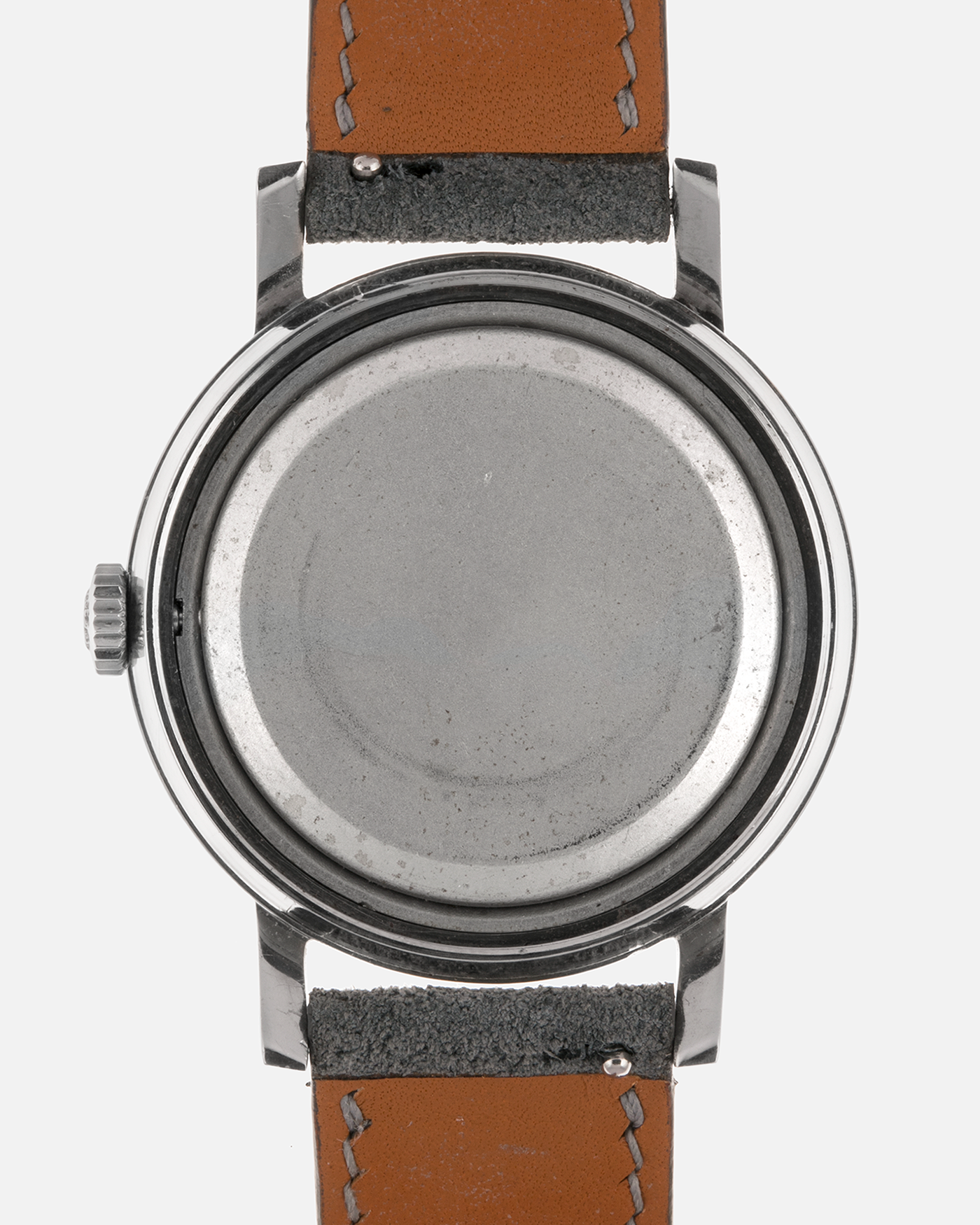 Brand: Patek Philippe
Year: 1966
Model: Calatrava, Gubelin Signed
Reference: 3417
Material: Stainless Steel
Movement: Patek Philippe Cal. 27-AM 400
Case Dimensions: 35mm Diameter 11mm Thickness
Lug Width: 18mm
Strap: Dream Rocketeers Grey Suede Strap with Generic Stainless Steel Buckle
