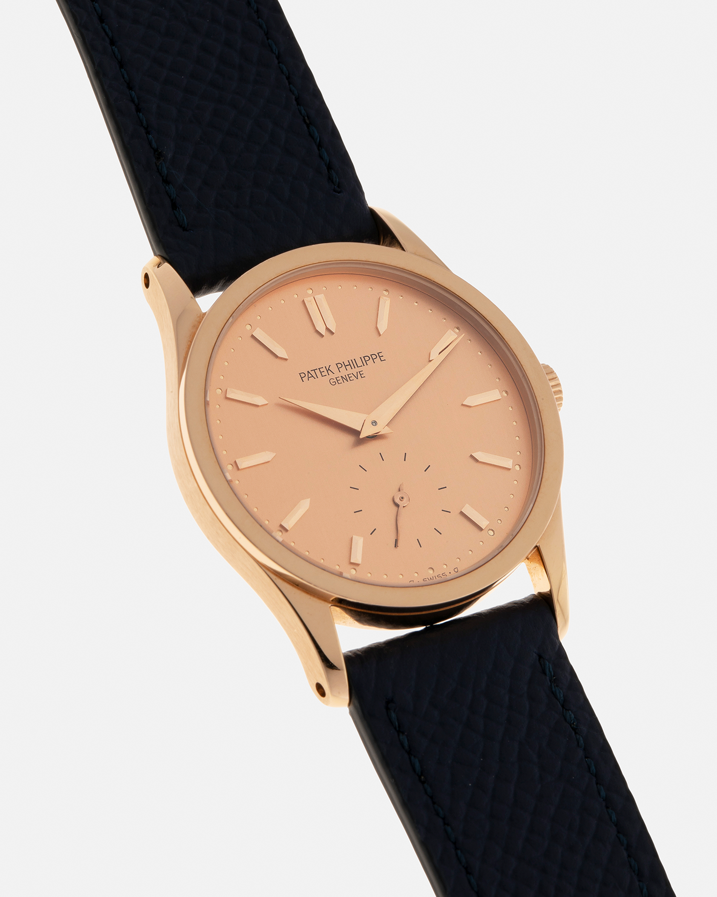 Brand: Patek Philippe
Year: 1993
Model: Calatrava
Reference: 3796R
Material: 18-carat Rose Gold
Movement: Patek Philippe Cal. 215 PS, Manual-Winding
Case Dimensions: 31mm x 7mm (Lug-to-Lug 37mm)
Lug Width: 18mm
Strap: Patek Philippe Black Alligator Leather Strap with Signed 18-carat Rose Gold Tang Buckle, additional Nostime Dark Navy Textured Calf Leather Strap