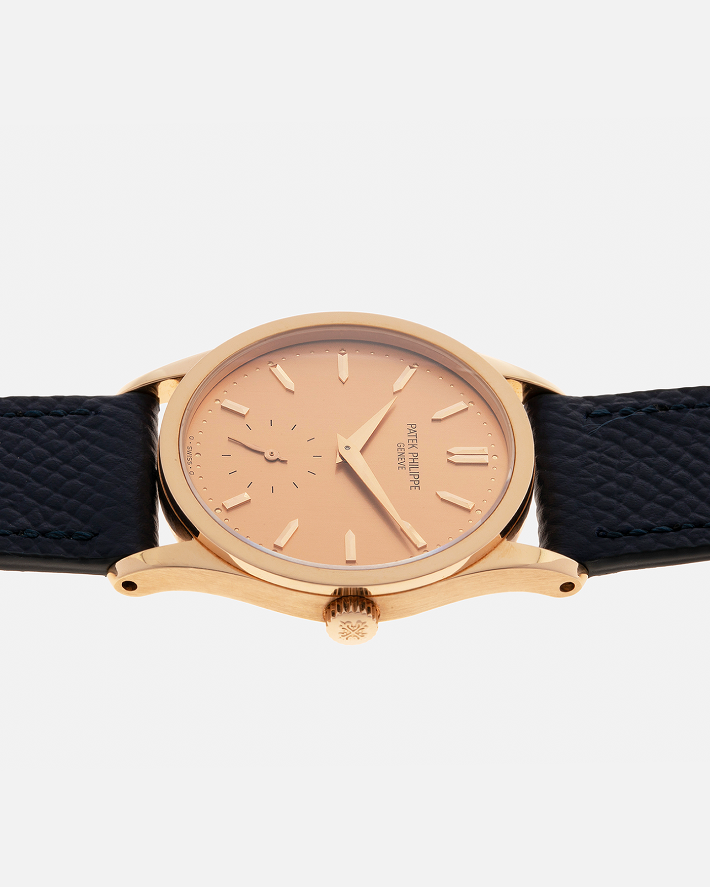 Brand: Patek Philippe
Year: 1993
Model: Calatrava
Reference: 3796R
Material: 18-carat Rose Gold
Movement: Patek Philippe Cal. 215 PS, Manual-Winding
Case Dimensions: 31mm x 7mm (Lug-to-Lug 37mm)
Lug Width: 18mm
Strap: Patek Philippe Black Alligator Leather Strap with Signed 18-carat Rose Gold Tang Buckle, additional Nostime Dark Navy Textured Calf Leather Strap