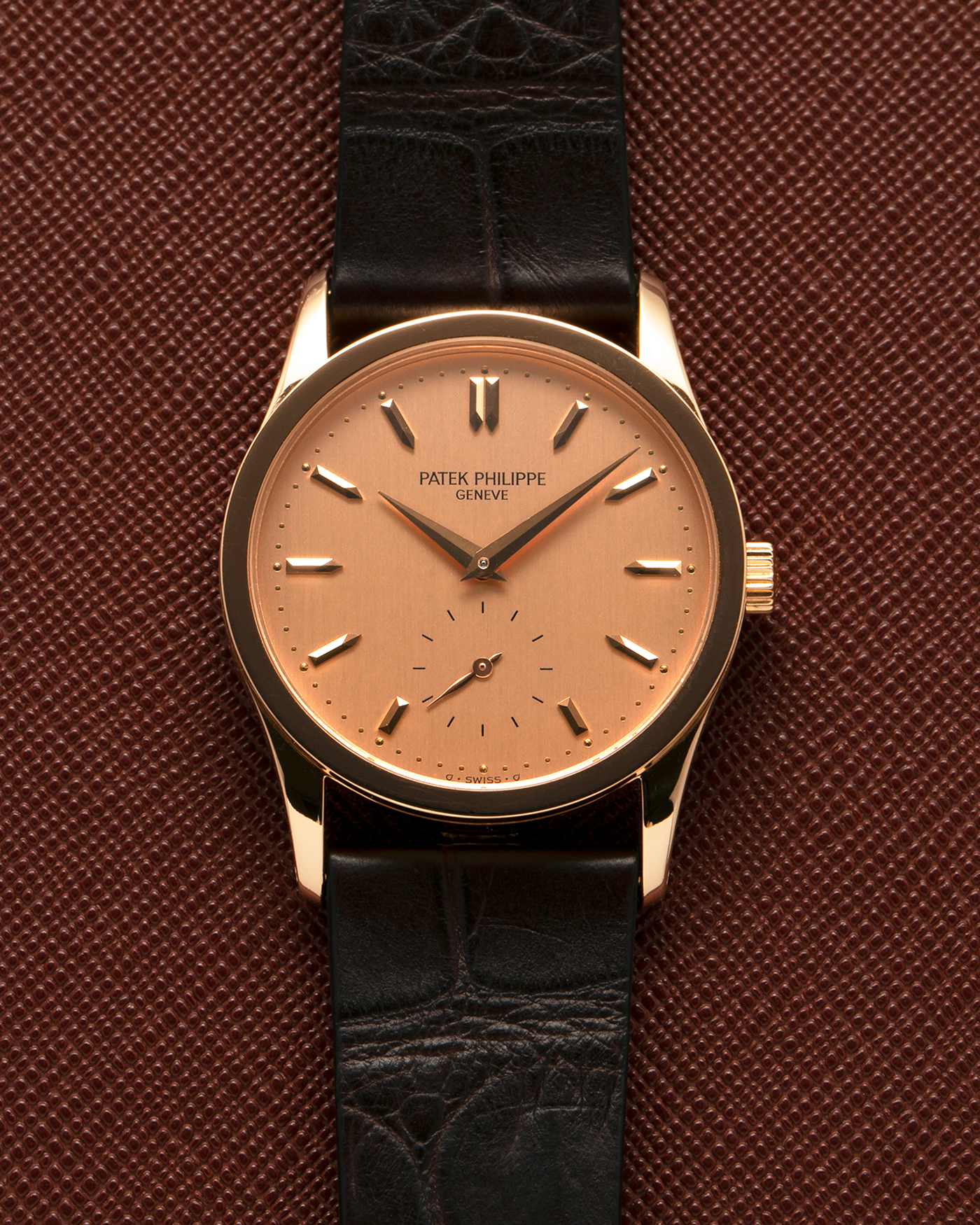 Brand: Patek Philippe
Year: 1993
Model: Calatrava
Reference: 3796R
Material: 18-carat Rose Gold
Movement: Patek Philippe Cal. 215 PS, Manual-Winding
Case Dimensions: 31mm x 7mm (Lug-to-Lug 37mm)
Lug Width: 18mm
Strap: Handdn Dark Brown Alligator Stitchless Leather Strap with Signed 18-carat Rose Gold Tang Buckle