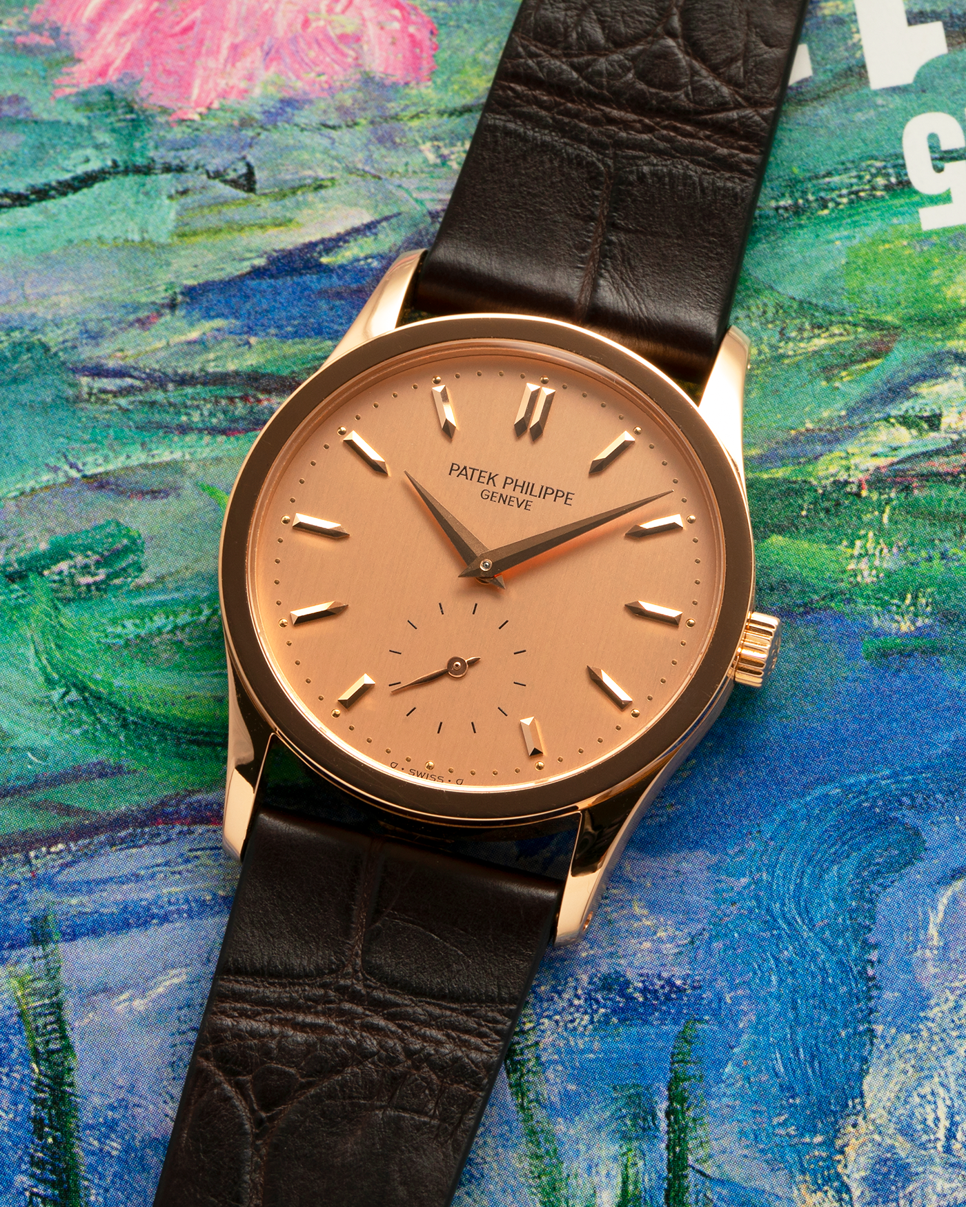 Brand: Patek Philippe
Year: 1993
Model: Calatrava
Reference: 3796R
Material: 18-carat Rose Gold
Movement: Patek Philippe Cal. 215 PS, Manual-Winding
Case Dimensions: 31mm x 7mm (Lug-to-Lug 37mm)
Lug Width: 18mm
Strap: Handdn Dark Brown Alligator Stitchless Leather Strap with Signed 18-carat Rose Gold Tang Buckle