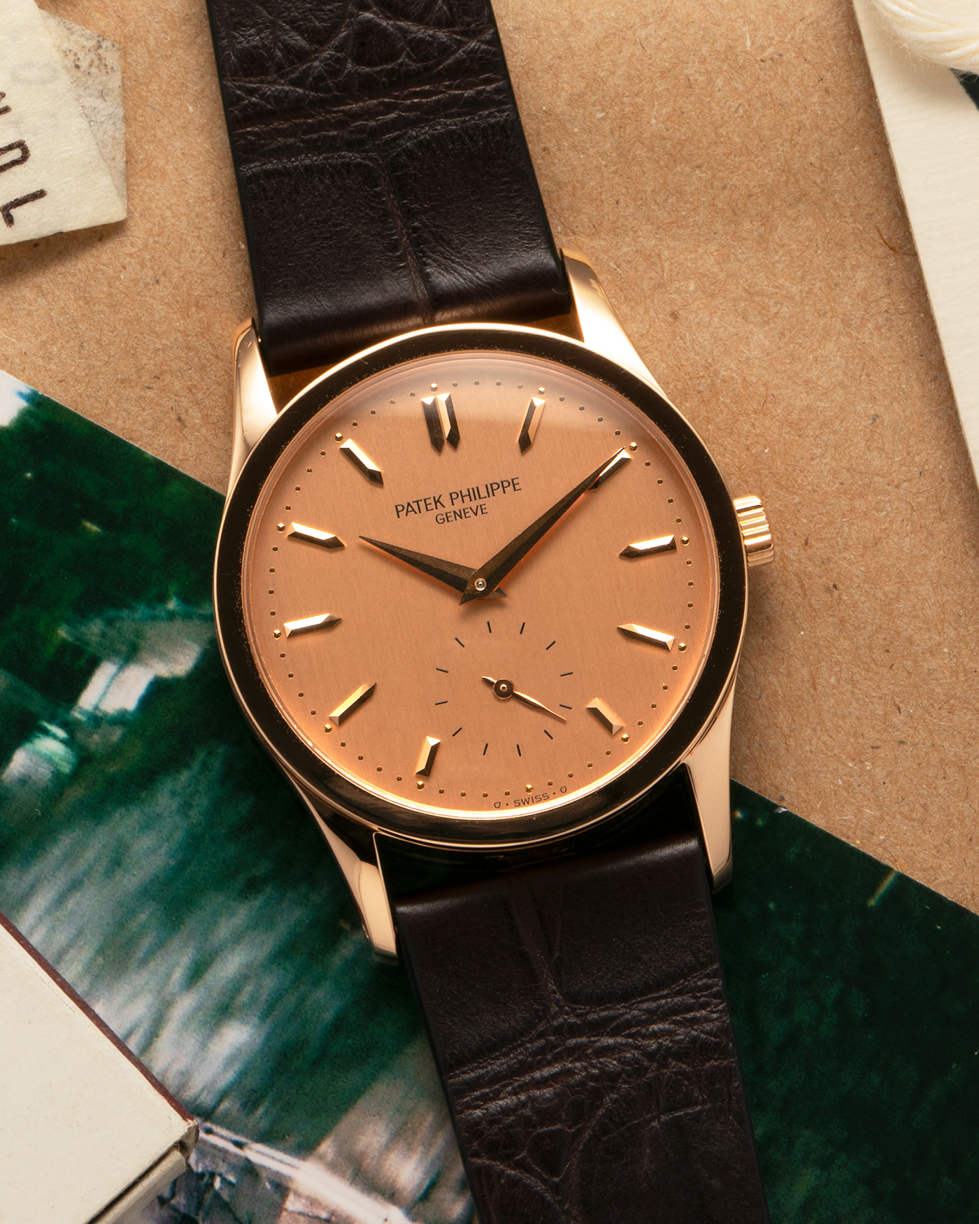 Brand: Patek Philippe
Year: 1993
Model: Calatrava
Reference: 3796R
Material: 18-carat Rose Gold
Movement: Patek Philippe Cal. 215 PS, Manual-Winding
Case Dimensions: 31mm x 7mm (Lug-to-Lug 37mm)
Lug Width: 18mm
Strap: Handdn Dark Brown Alligator Stitchless Leather Strap with Signed 18-carat Rose Gold Tang Buckle