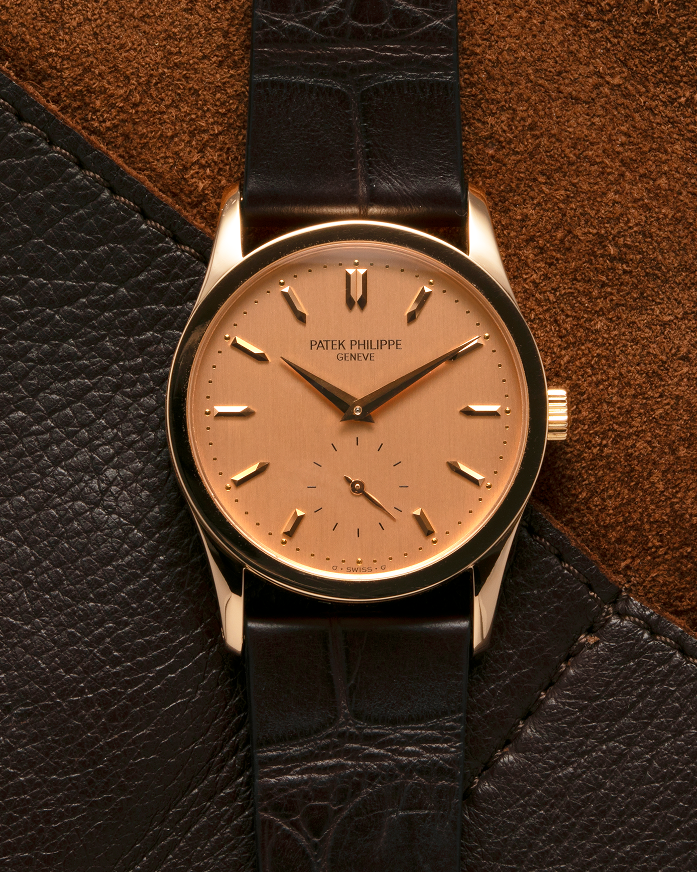 Brand: Patek Philippe
Year: 1993
Model: Calatrava
Reference: 3796R
Material: 18-carat Rose Gold
Movement: Patek Philippe Cal. 215 PS, Manual-Winding
Case Dimensions: 31mm x 7mm (Lug-to-Lug 37mm)
Lug Width: 18mm
Strap: Handdn Dark Brown Alligator Stitchless Leather Strap with Signed 18-carat Rose Gold Tang Buckle