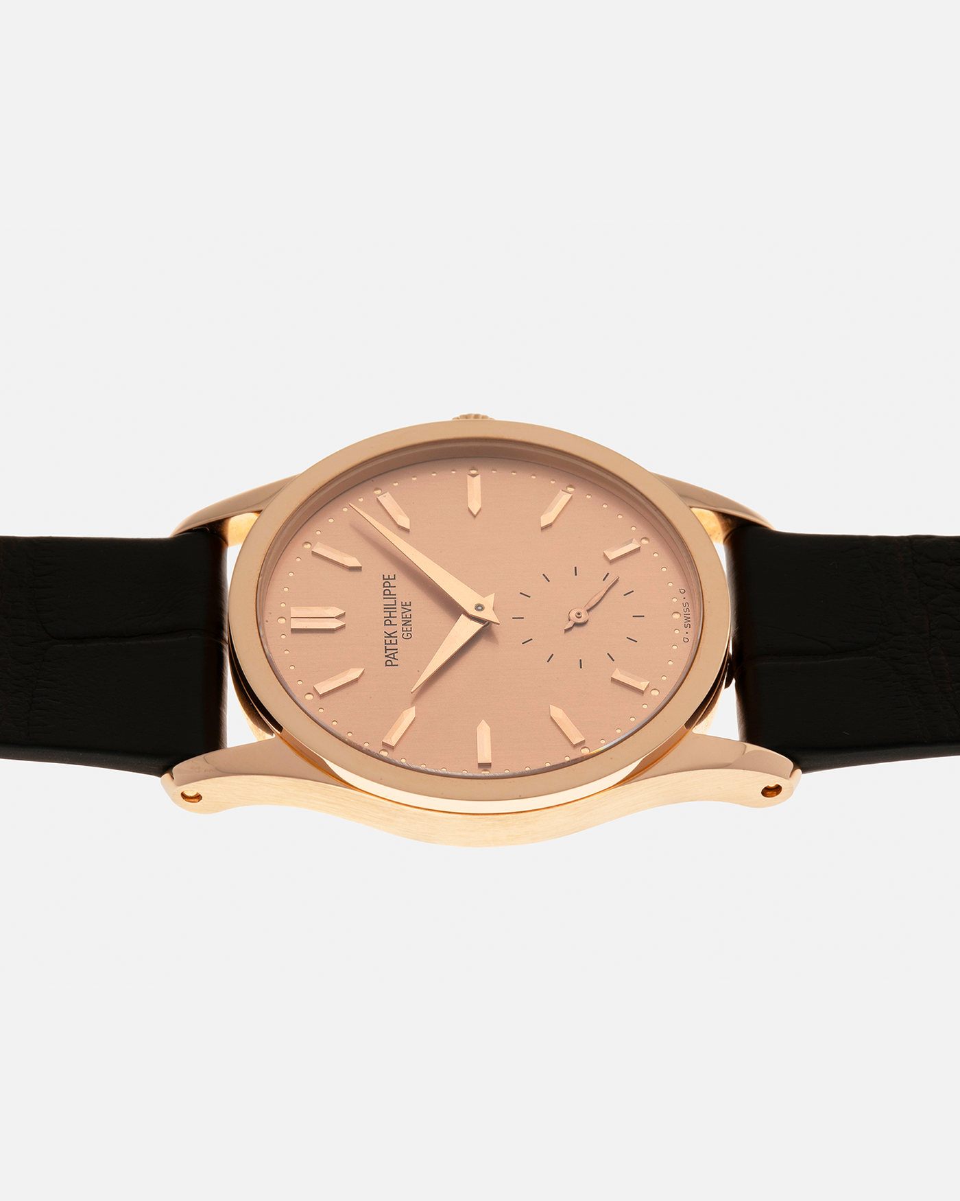 Brand: Patek Philippe
Year: 1993
Model: Calatrava
Reference: 3796R
Material: 18-carat Rose Gold
Movement: Patek Philippe Cal. 215 PS, Manual-Winding
Case Dimensions: 31mm x 7mm (Lug-to-Lug 37mm)
Lug Width: 18mm
Strap: Handdn Dark Brown Alligator Stitchless Leather Strap with Signed 18-carat Rose Gold Tang Buckle