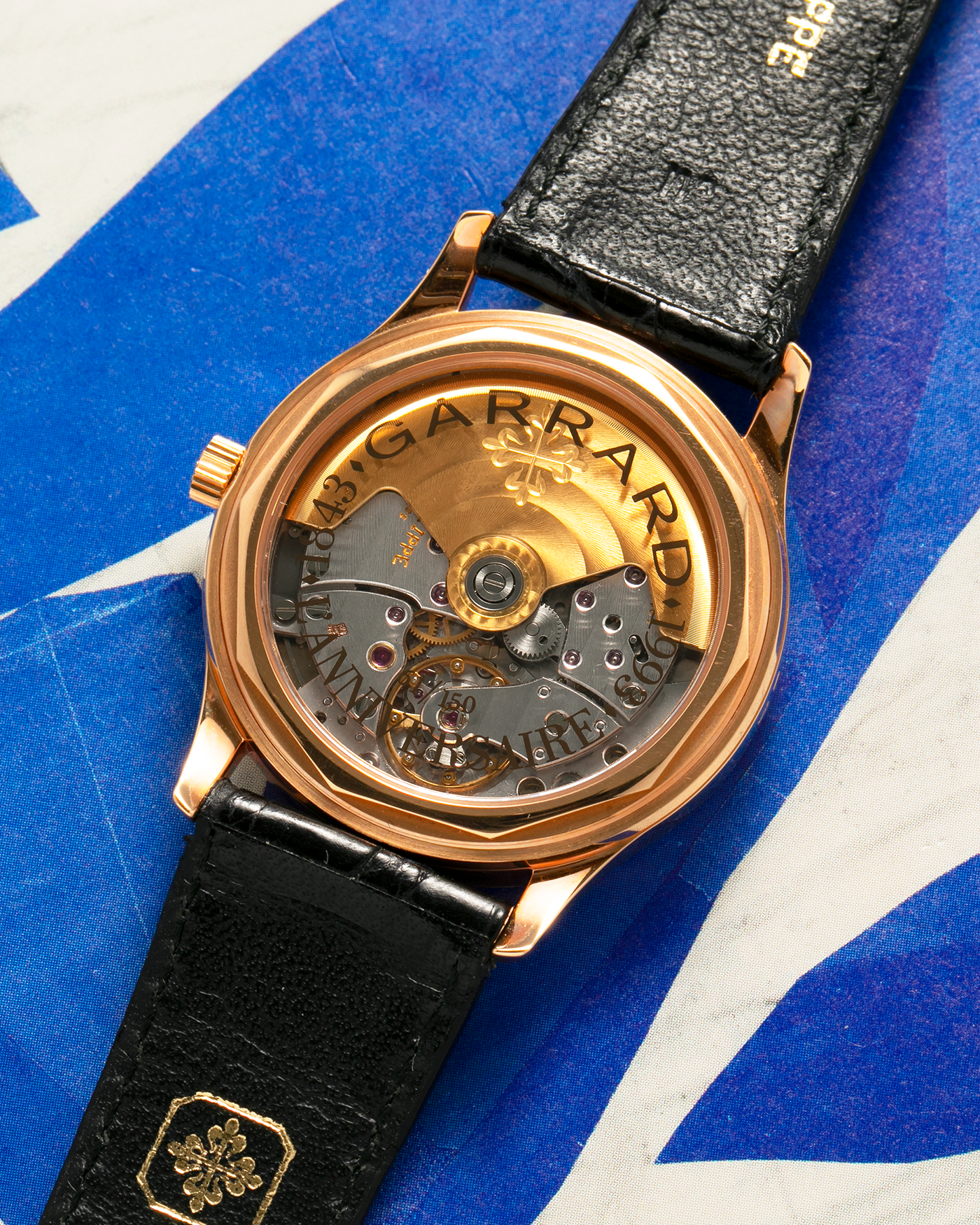 Brand: Patek Philippe
Year: 1993
Model: Calatrava ‘Garrard 150th Anniversary’, Limited to 150 Pieces
Reference: 3998SR
Material: 18-carat Rose Gold
Movement: Patek Philippe Cal. 315 SC, Self-Winding
Case Dimensions: 33.5mm x 8mm (Lug-to-Lug 42mm)
Lug Width: 18mm
Strap: Patek Philippe Black Alligator Strap with Signed 18-carat Rose Gold Tang Buckle