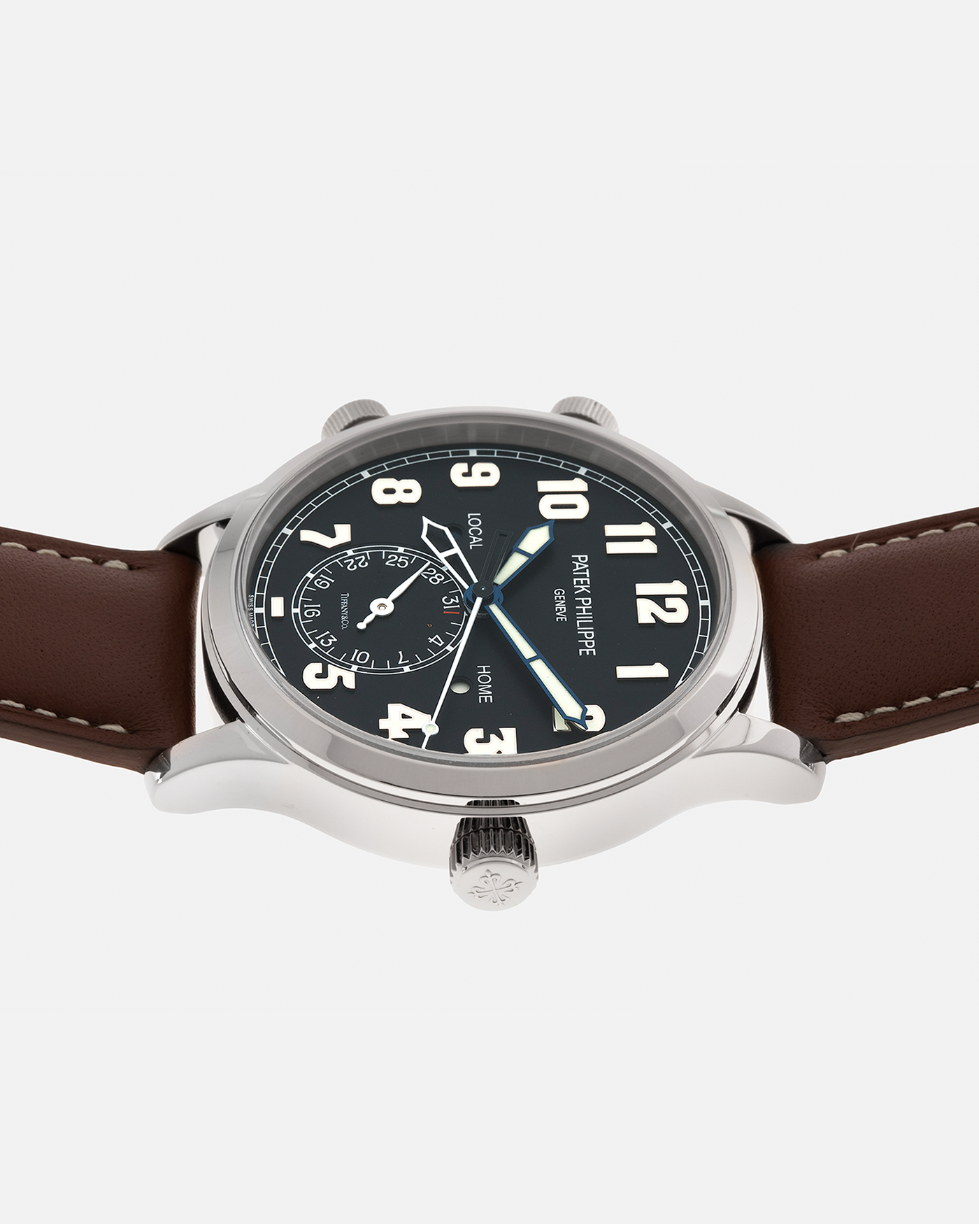 Brand: Patek Philippe
Year: 2020
Model: Calatrava Pilot Travel Time ‘Tiffany & Co.’
Reference: 5524G
Material: 18-carat White Gold
Movement: Patek Philippe Cal. 324 S C FUS, Self-Winding
Case Diameter: 42mm x 10.8mm (Lug-to-Lug 50mm)
Lug Width: 22mm
Strap: Patek Philippe Brown Leather Strap with Signed 18-carat White Gold Tang Buckle