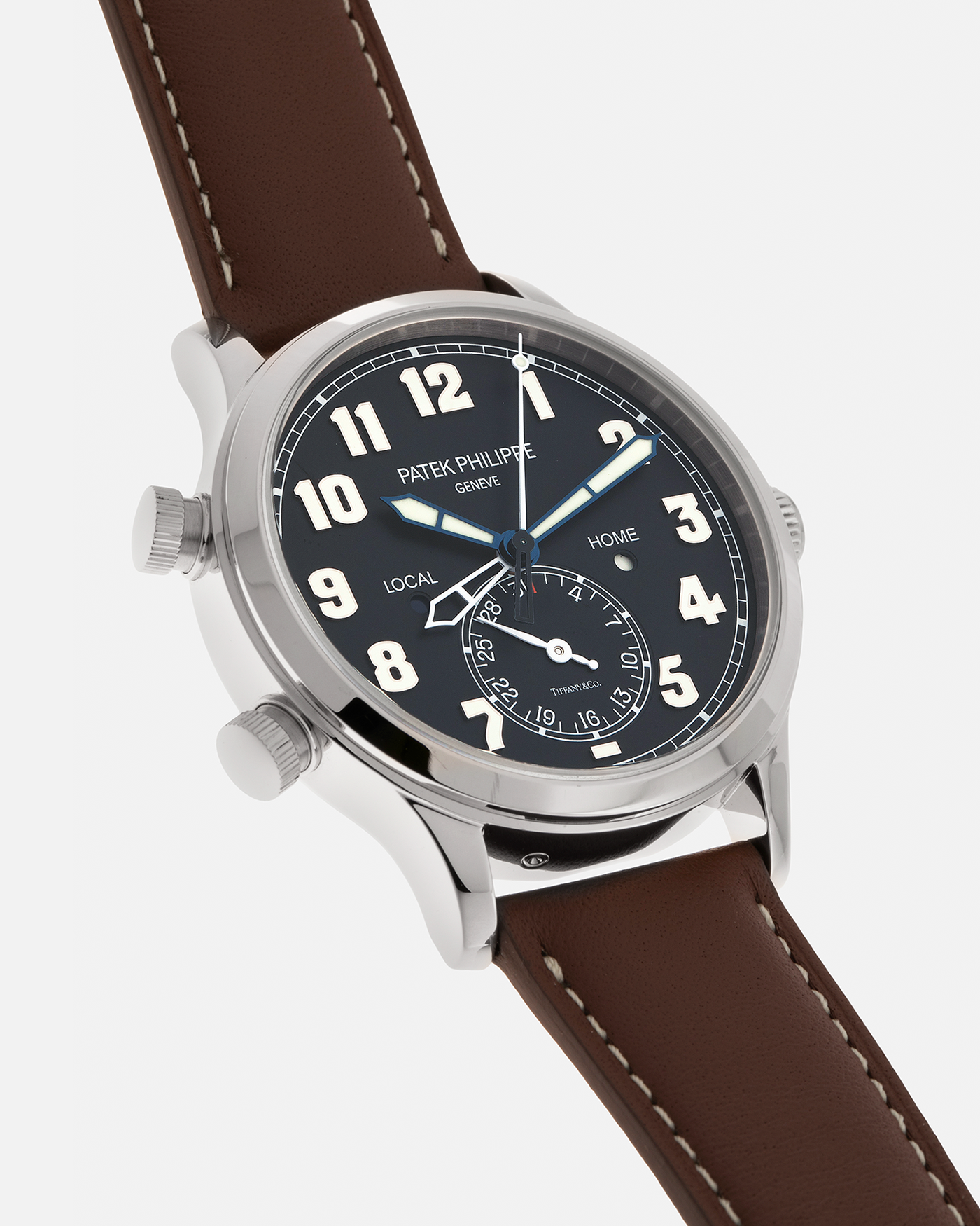 Brand: Patek Philippe
Year: 2020
Model: Calatrava Pilot Travel Time ‘Tiffany & Co.’
Reference: 5524G
Material: 18-carat White Gold
Movement: Patek Philippe Cal. 324 S C FUS, Self-Winding
Case Diameter: 42mm x 10.8mm (Lug-to-Lug 50mm)
Lug Width: 22mm
Strap: Patek Philippe Brown Leather Strap with Signed 18-carat White Gold Tang Buckle