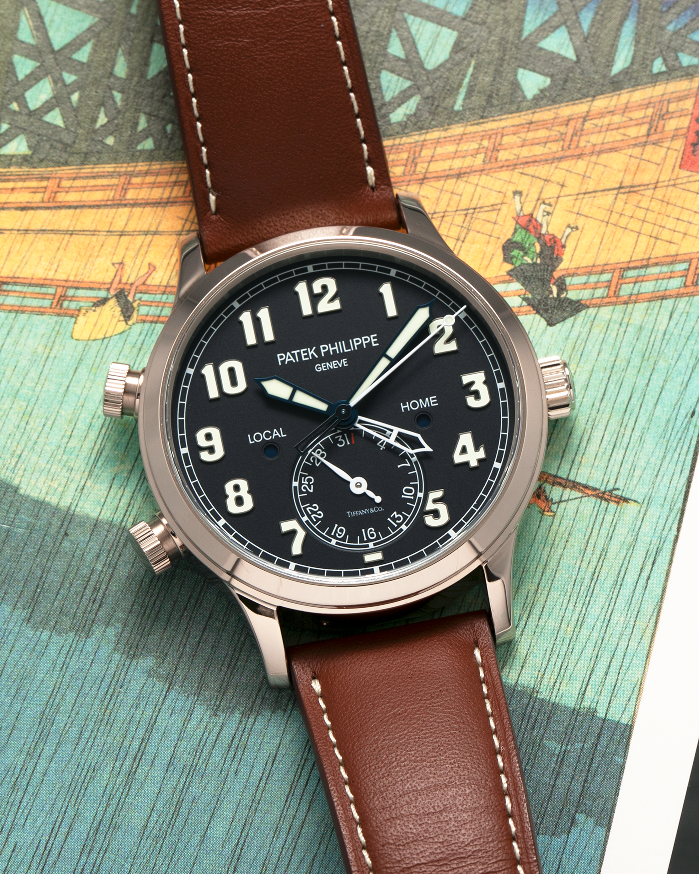 Brand: Patek Philippe
Year: 2020
Model: Calatrava Pilot Travel Time ‘Tiffany & Co.’
Reference: 5524G
Material: 18-carat White Gold
Movement: Patek Philippe Cal. 324 S C FUS, Self-Winding
Case Diameter: 42mm x 10.8mm (Lug-to-Lug 50mm)
Lug Width: 22mm
Strap: Patek Philippe Brown Leather Strap with Signed 18-carat White Gold Tang Buckle