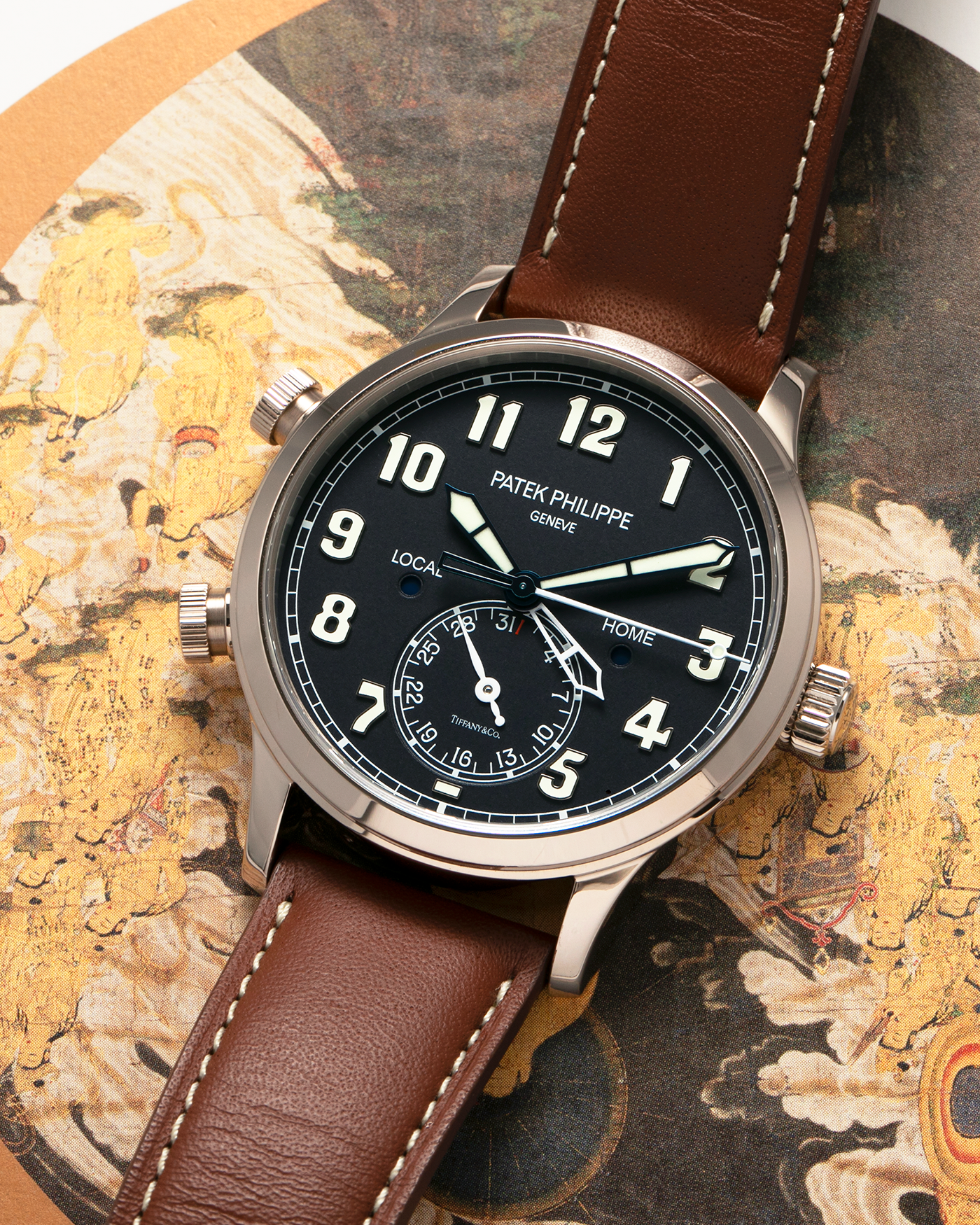Brand: Patek Philippe
Year: 2020
Model: Calatrava Pilot Travel Time ‘Tiffany & Co.’
Reference: 5524G
Material: 18-carat White Gold
Movement: Patek Philippe Cal. 324 S C FUS, Self-Winding
Case Diameter: 42mm x 10.8mm (Lug-to-Lug 50mm)
Lug Width: 22mm
Strap: Patek Philippe Brown Leather Strap with Signed 18-carat White Gold Tang Buckle