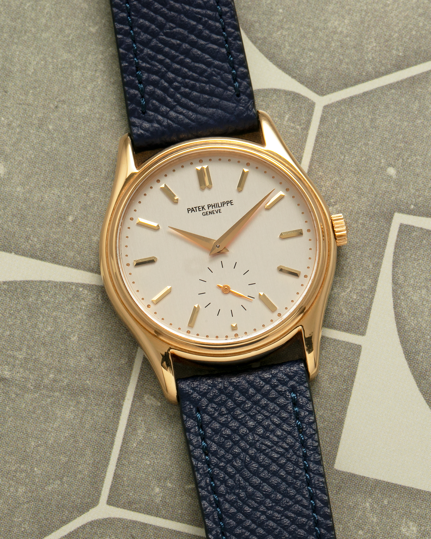 Brand: Patek Philippe
Year: 1990’s
Model: Calatrava
Reference: 5023
Material: 18-carat Yellow Gold
Movement: Patek Philippe Cal. 215 PS, Manual-Winding
Case Diameter: 33mm x 7mm (39.8mm Lug-to-Lug)
Lug Width: 18mm
Strap: Molequin Navy Blue Grained Calf Strap with Signed 18-carat Yellow Gold Tang Buckle