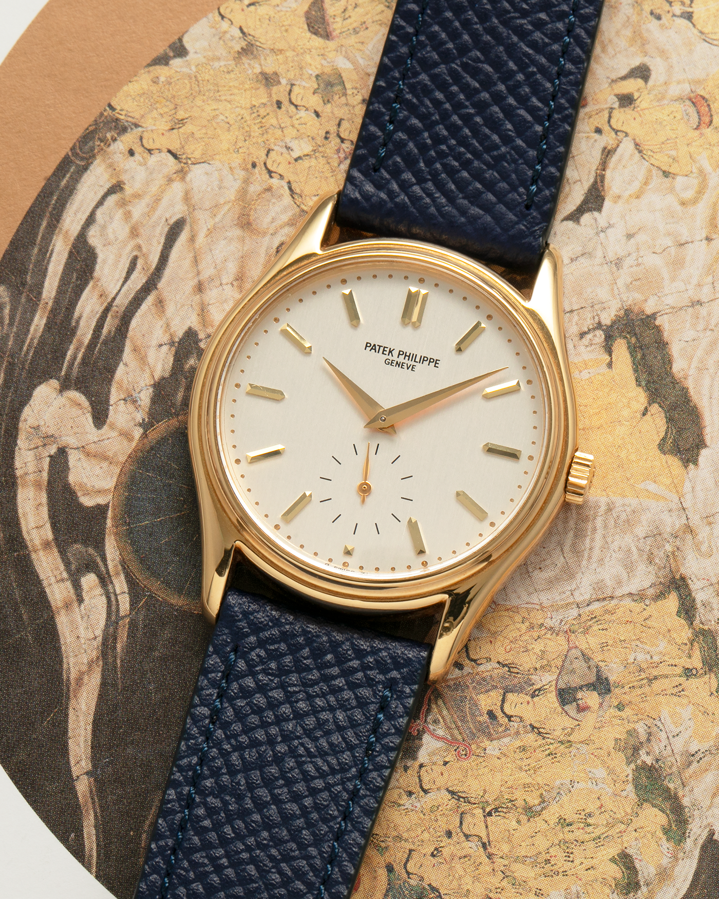 Brand: Patek Philippe
Year: 1990’s
Model: Calatrava
Reference: 5023
Material: 18-carat Yellow Gold
Movement: Patek Philippe Cal. 215 PS, Manual-Winding
Case Diameter: 33mm x 7mm (39.8mm Lug-to-Lug)
Lug Width: 18mm
Strap: Molequin Navy Blue Grained Calf Strap with Signed 18-carat Yellow Gold Tang Buckle