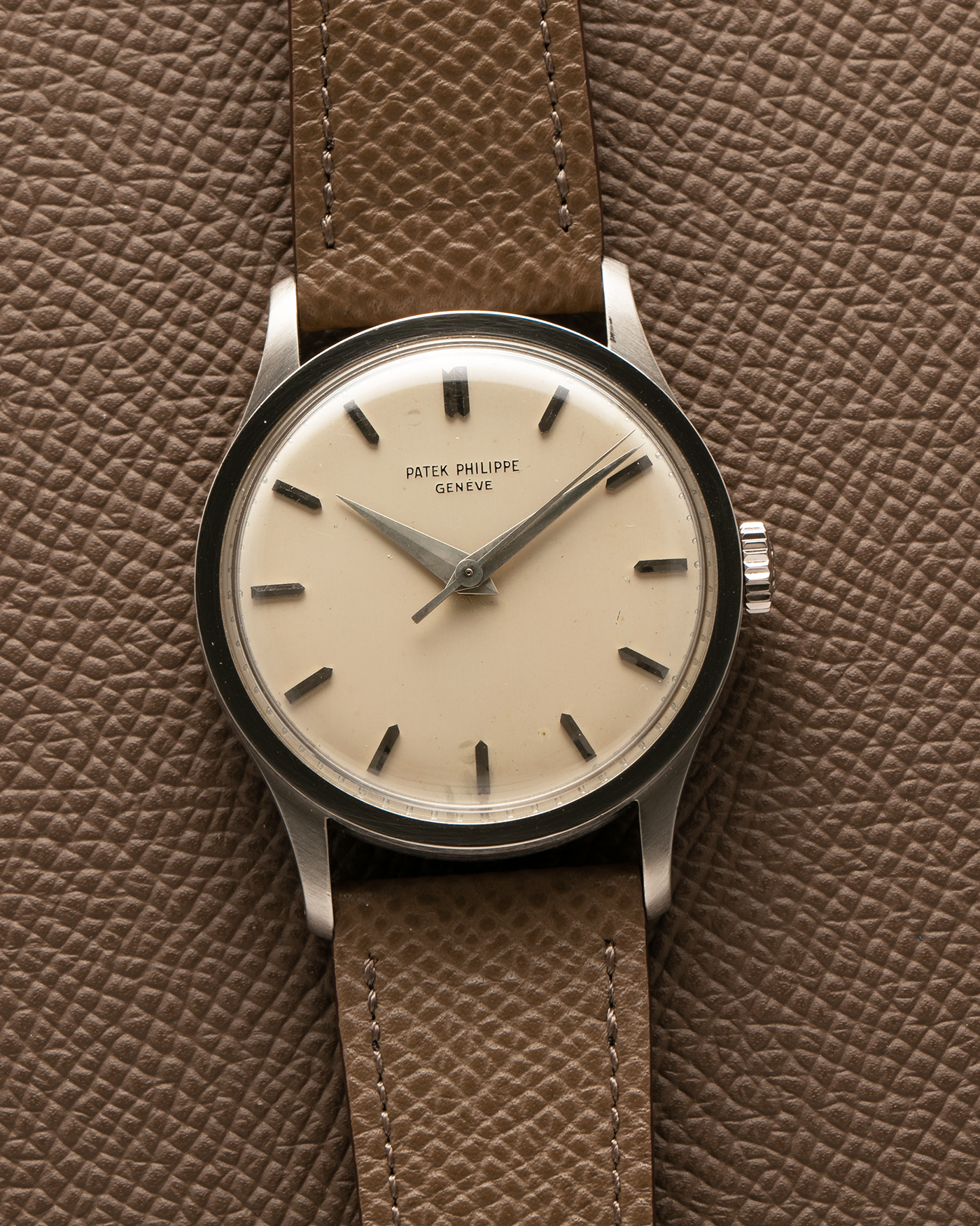 Brand: Patek Philippe Year: 1965 Model: Calatrava Reference: 570 Material: 18-carat White Gold Movement: Patek Philippe Cal. 27 SC, Manual-Winding Case Diameter: 35.5mm Lug Width: 20mm Strap: Nostime Taupe Grained Calf Leather Strap, additional Generic Black Alligator Leather Strap with Signed 18-carat White Gold Tang Buckle