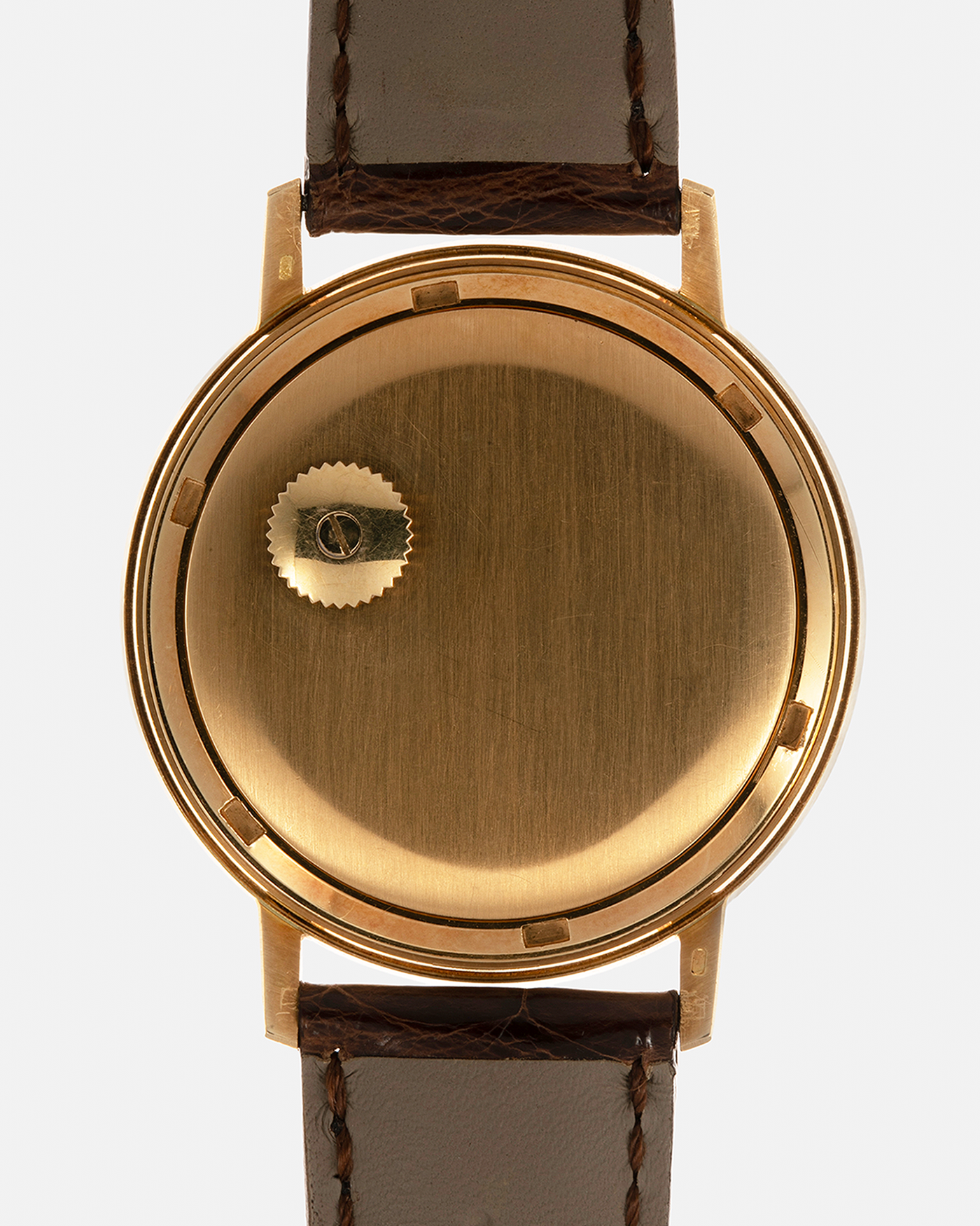 Brand: Patek Philippe
Year: 1970
Model: Calatrava ‘Back Wind’ Hammered
Reference Number: 3569J
Material: 18-carat Yellow Gold
Movement: Patek Philippe Back-Wind Cal. 350, Self-Winding
Case Dimensions: 36mm x 8.3mm (Lug-to-Lug 41mm)
Lug Width: 18mm
Strap: Patek Philippe Dark Brown Alligator Leather Strap with Signed 18-carat Yellow Gold Tang Buckle