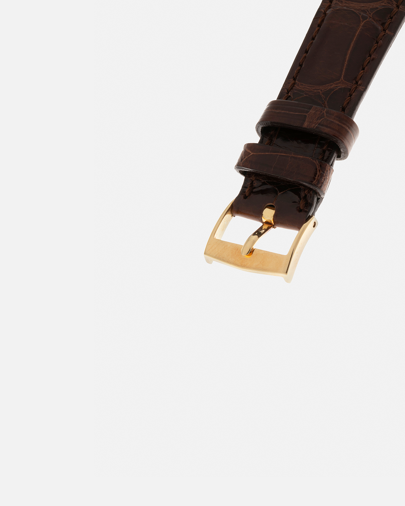 Brand: Patek Philippe
Year: 1970
Model: Calatrava ‘Back Wind’ Hammered
Reference Number: 3569J
Material: 18-carat Yellow Gold
Movement: Patek Philippe Back-Wind Cal. 350, Self-Winding
Case Dimensions: 36mm x 8.3mm (Lug-to-Lug 41mm)
Lug Width: 18mm
Strap: Patek Philippe Dark Brown Alligator Leather Strap with Signed 18-carat Yellow Gold Tang Buckle