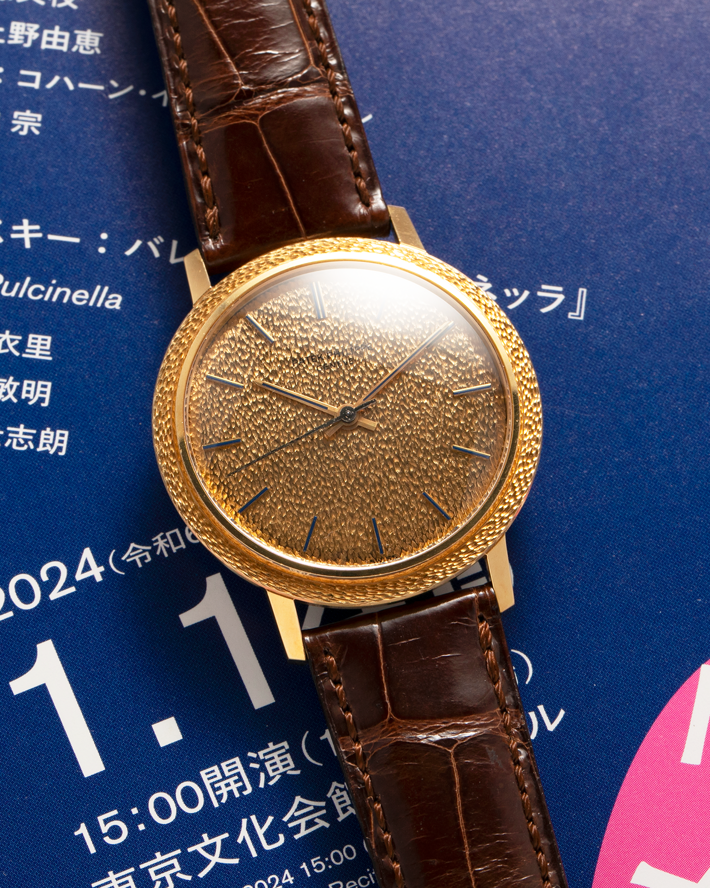 Brand: Patek Philippe
Year: 1970
Model: Calatrava ‘Back Wind’ Hammered
Reference Number: 3569J
Material: 18-carat Yellow Gold
Movement: Patek Philippe Back-Wind Cal. 350, Self-Winding
Case Dimensions: 36mm x 8.3mm (Lug-to-Lug 41mm)
Lug Width: 18mm
Strap: Patek Philippe Dark Brown Alligator Leather Strap with Signed 18-carat Yellow Gold Tang Buckle