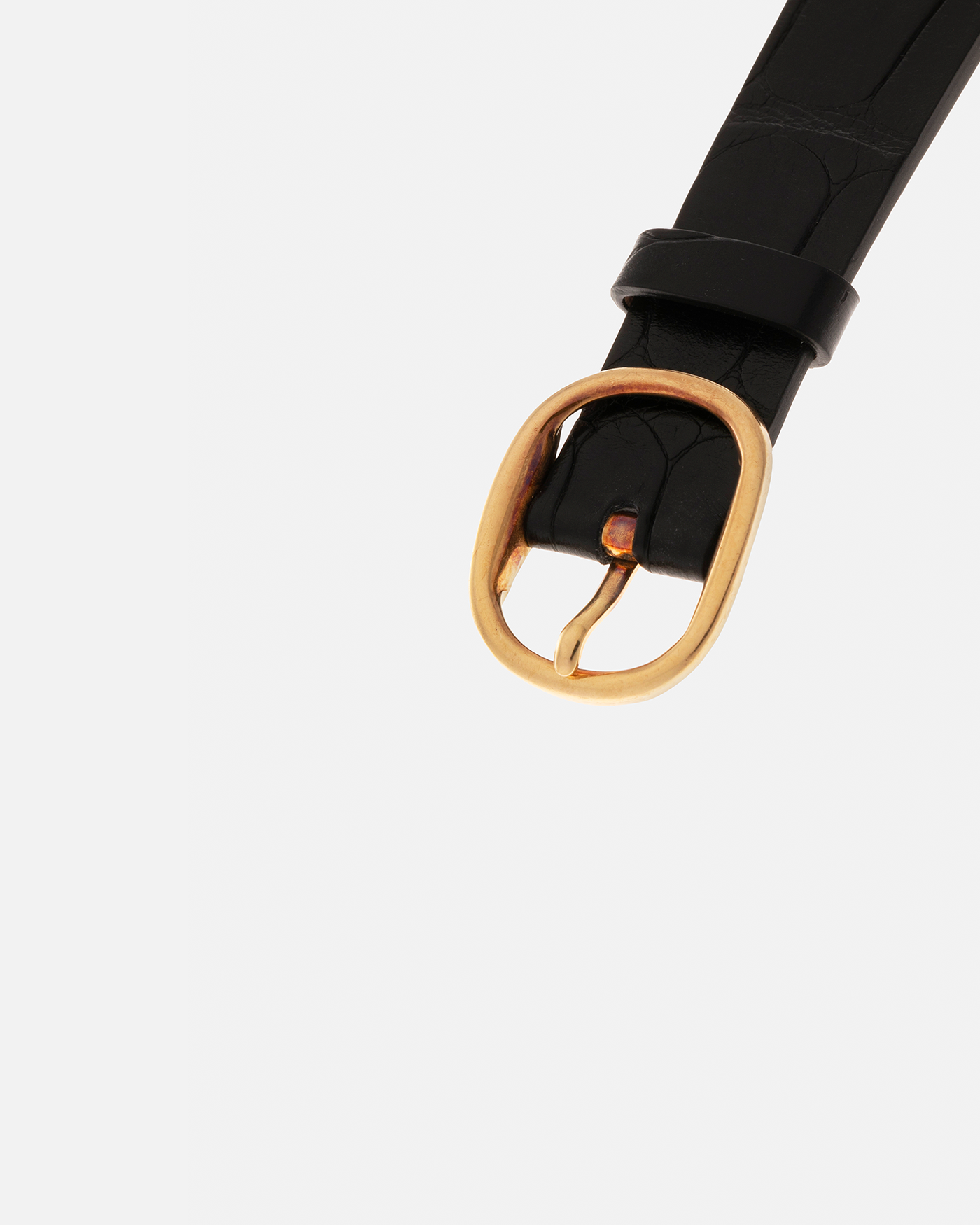 Brand: Patek Philippe
Year: 1977
Model: Ellipse
Reference Number: 3730
Material: 18-carat Yellow Gold Case, Onyx Dial
Movement: Patek Philippe Cal. 215, Manual-Winding
Case Dimensions: 31mm x 6mm (Lug-to-Lug 38.5mm)
Lug Width: 17mm
Strap: Custom Handdn Black Alligator Stitchless Leather Strap with Signed 18-carat Yellow Gold Ellipse Buckle