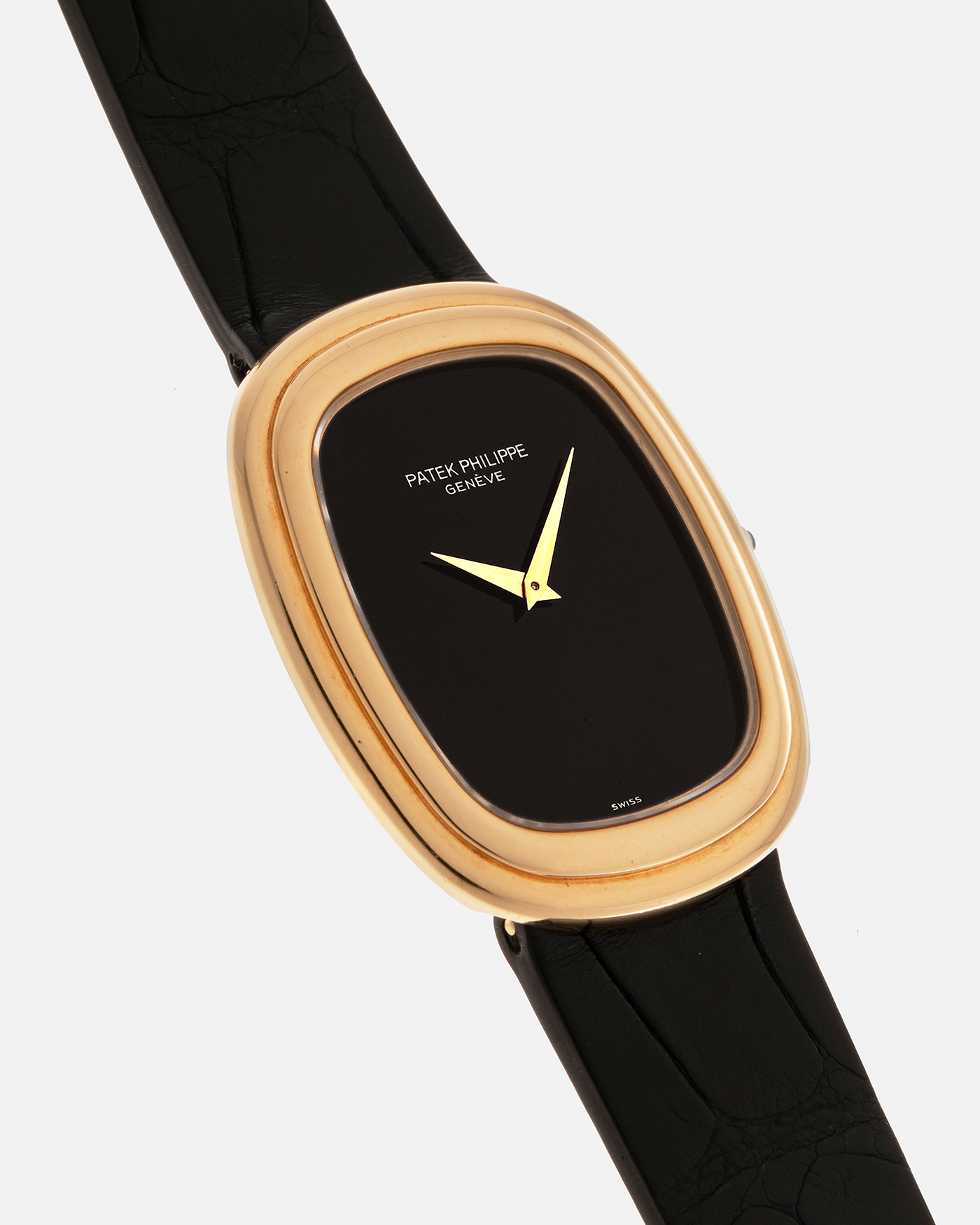 Brand: Patek Philippe
Year: 1977
Model: Ellipse
Reference Number: 3730
Material: 18-carat Yellow Gold Case, Onyx Dial
Movement: Patek Philippe Cal. 215, Manual-Winding
Case Dimensions: 31mm x 6mm (Lug-to-Lug 38.5mm)
Lug Width: 17mm
Strap: Custom Handdn Black Alligator Stitchless Leather Strap with Signed 18-carat Yellow Gold Ellipse Buckle