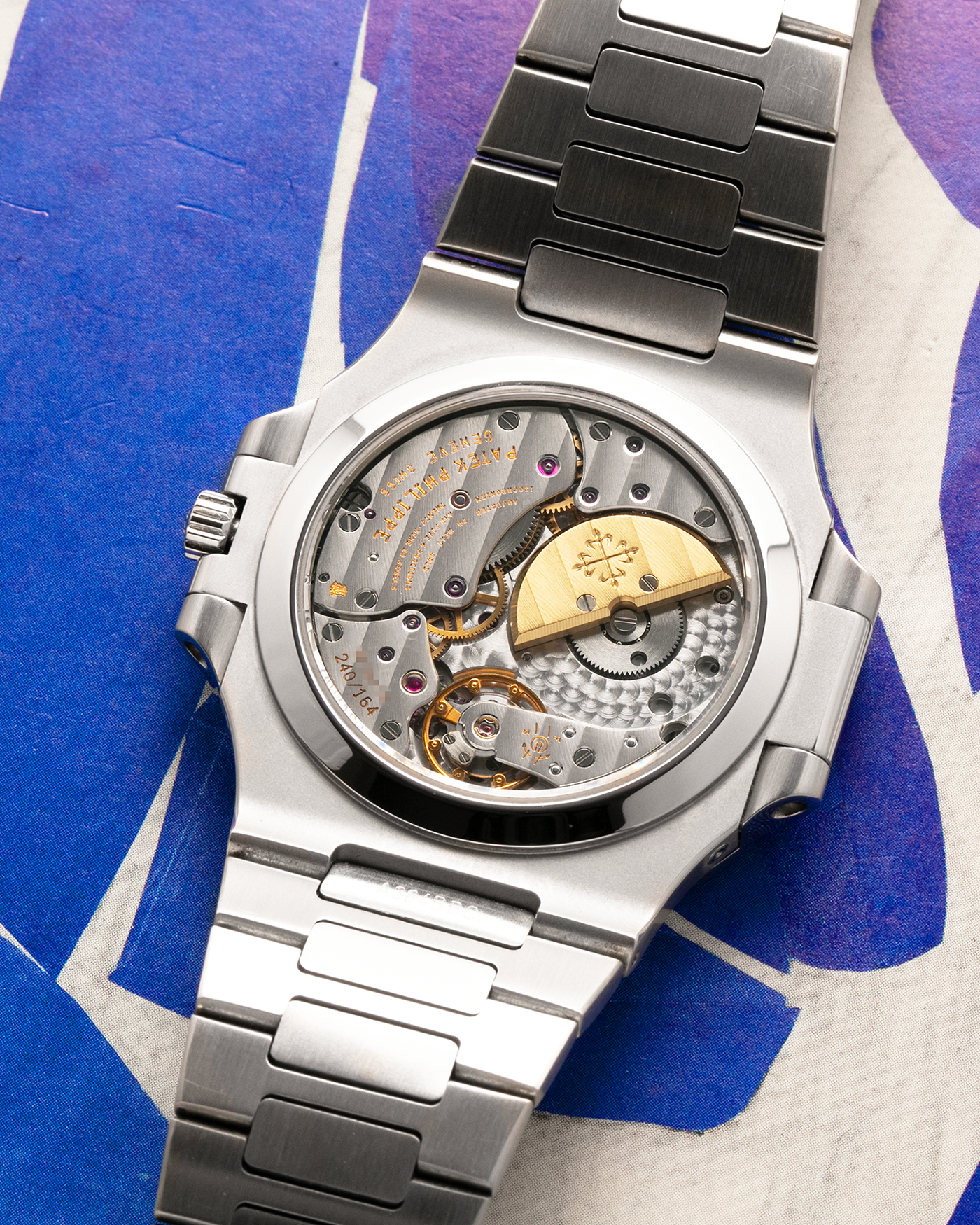 Brand: Patek Philippe
Year: 2005
Model: Nautilus
Reference Number: 3712A
Material: Stainless Steel
Movement: Patek Philippe Calibre 240 PS IRM C LU, Self-Winding
Case Dimensions: 40mm Diameter, 8.5mm Thickness
Bracelet: Patek Philippe Integrated 18-carat Rose Gold Bracelet