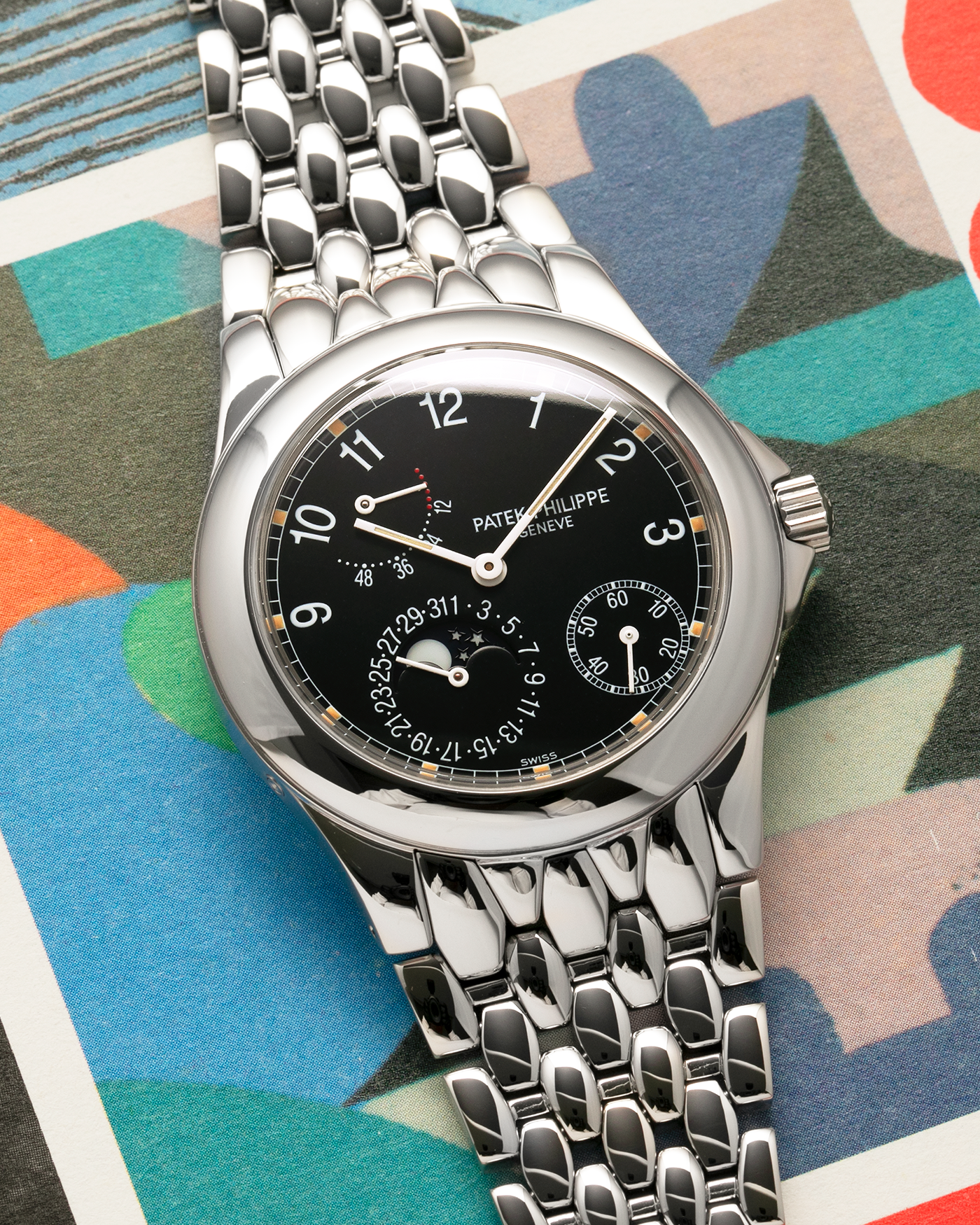 Brand: Patek Philippe
Year: 2001
Reference: 5085A Neptune
Material: Stainless Steel
Movement: Patek Philippe Cal. 240/164 PS IRM C LU, Self-Winding Micro-Rotor
Case Dimensions: 37mm x 10mm (Lug-to-Lug 43.5mm)
Bracelet: Patek Philippe Stainless Steel Multi-Link Fish-Scale Bracelet with Double-Folding Clasp
