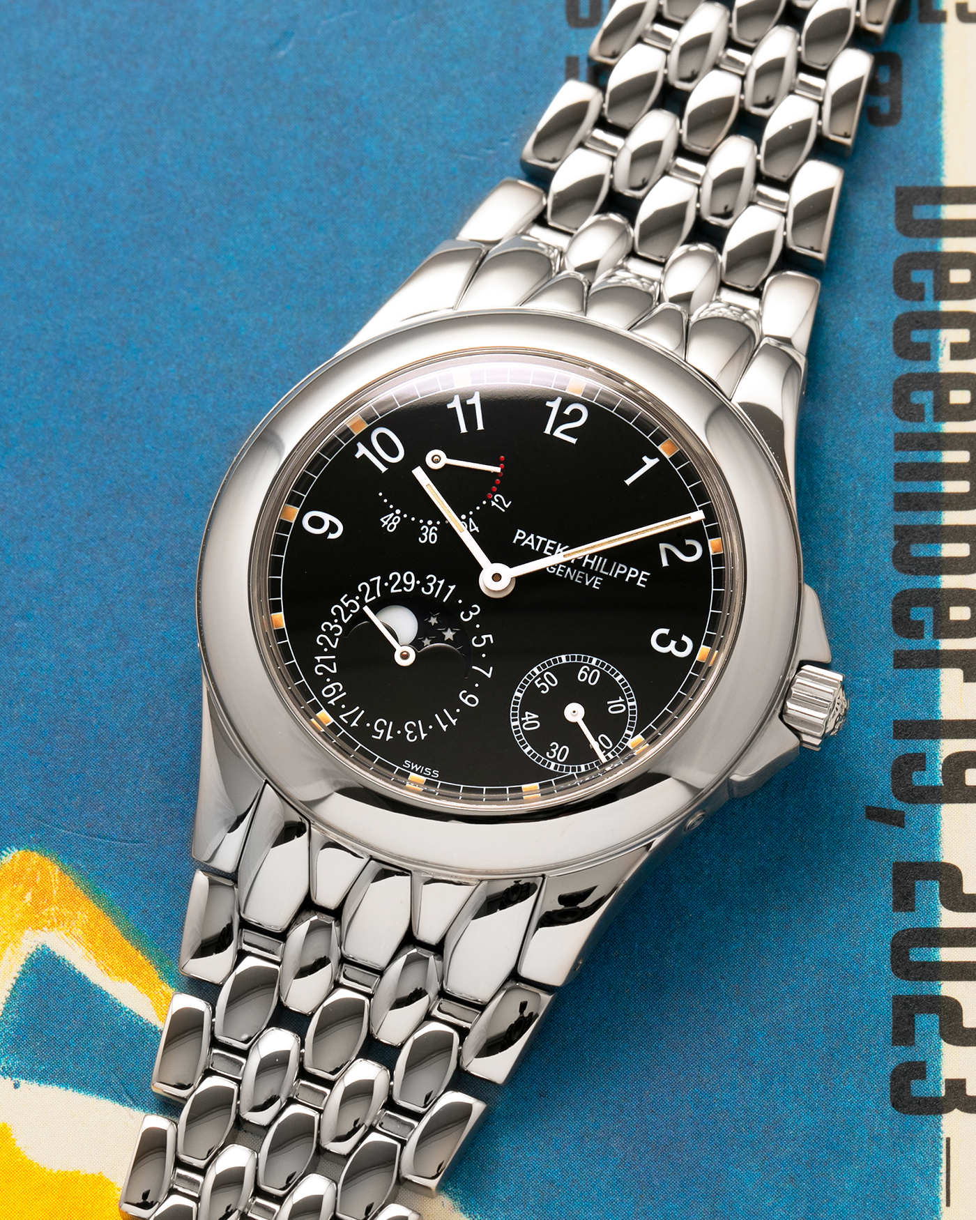 Brand: Patek Philippe
Year: 2001
Reference: 5085A Neptune
Material: Stainless Steel
Movement: Patek Philippe Cal. 240/164 PS IRM C LU, Self-Winding Micro-Rotor
Case Dimensions: 37mm x 10mm (Lug-to-Lug 43.5mm)
Bracelet: Patek Philippe Stainless Steel Multi-Link Fish-Scale Bracelet with Double-Folding Clasp
