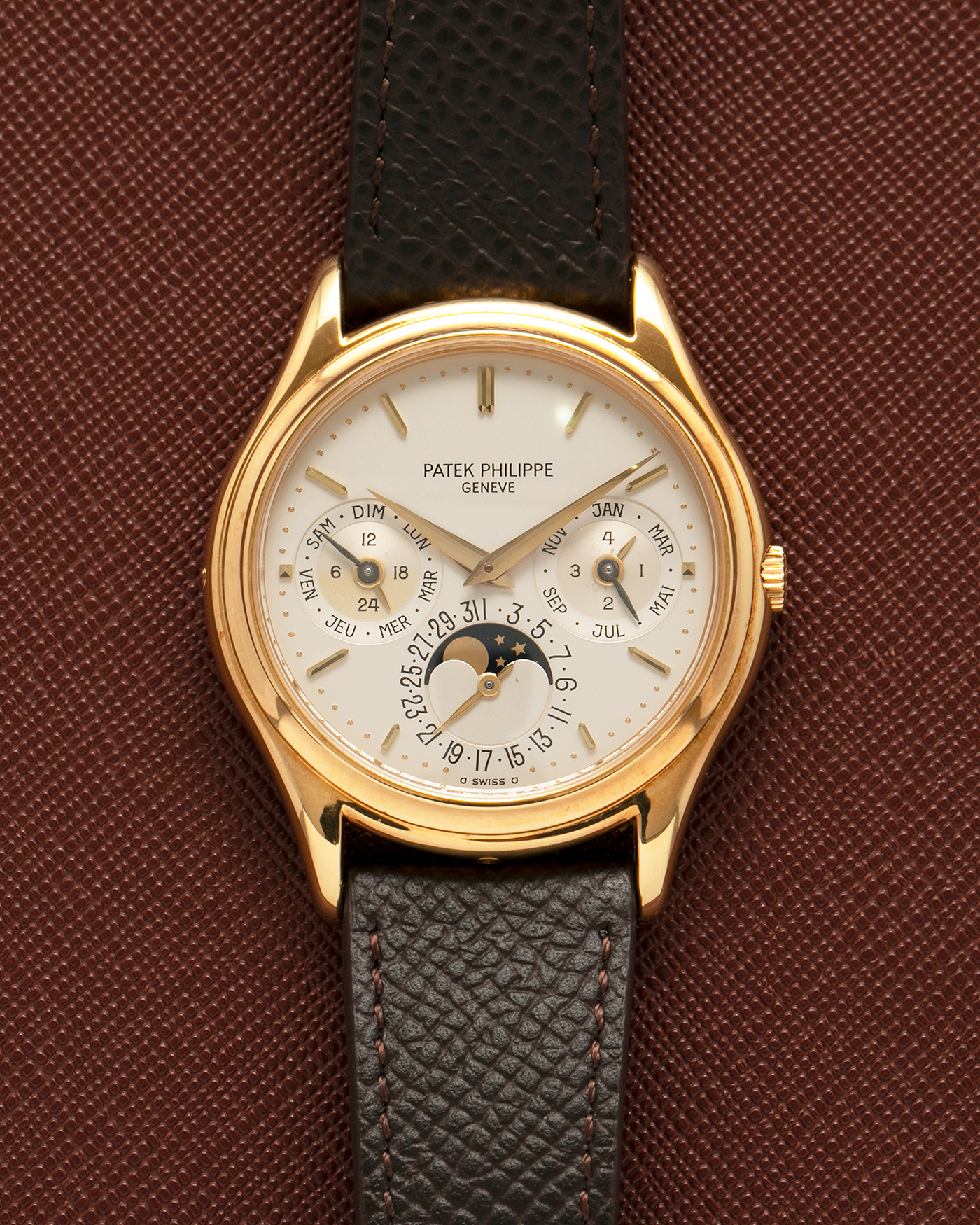 Brand: Patek Philippe
Year: 1989
Model: Perpetual Calendar ‘2nd Series’
Reference Number: 3940J
Material: 18-carat Yellow Gold
Movement: Patek Philippe Cal. 240Q, Self-Winding Micro-Rotor
Case Dimensions: 36mm x 8.5mm (Lug-to-Lug 43.3mm)
Lug Width: 18mm
Strap: Sotheby’s Dark Brown Textured Calf Leather Strap with Signed 18-carat Yellow Gold Tang Buckle