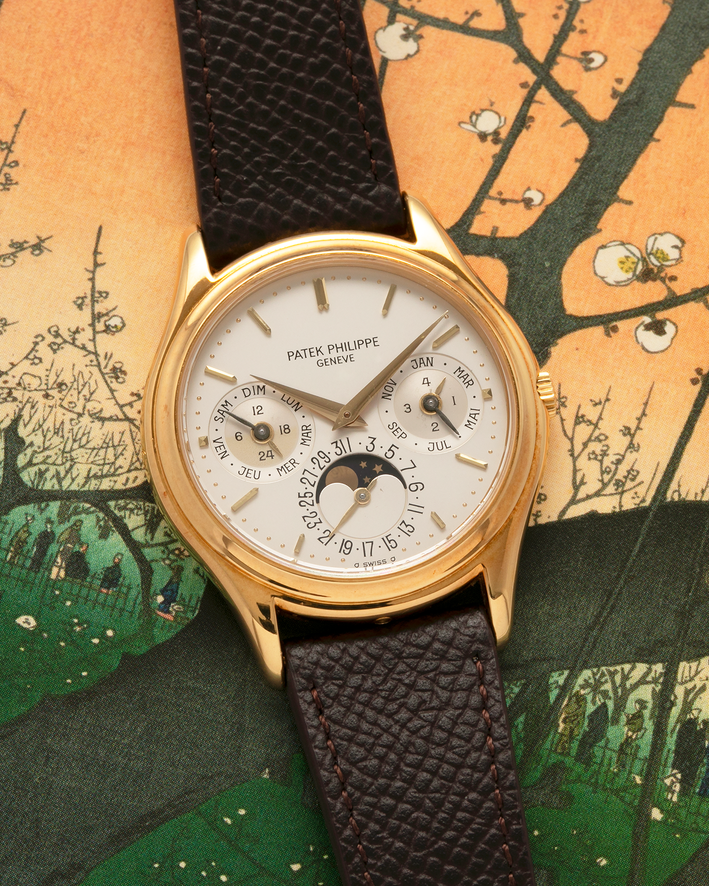 Brand: Patek Philippe
Year: 1989
Model: Perpetual Calendar ‘2nd Series’
Reference Number: 3940J
Material: 18-carat Yellow Gold
Movement: Patek Philippe Cal. 240Q, Self-Winding Micro-Rotor
Case Dimensions: 36mm x 8.5mm (Lug-to-Lug 43.3mm)
Lug Width: 18mm
Strap: Sotheby’s Dark Brown Textured Calf Leather Strap with Signed 18-carat Yellow Gold Tang Buckle