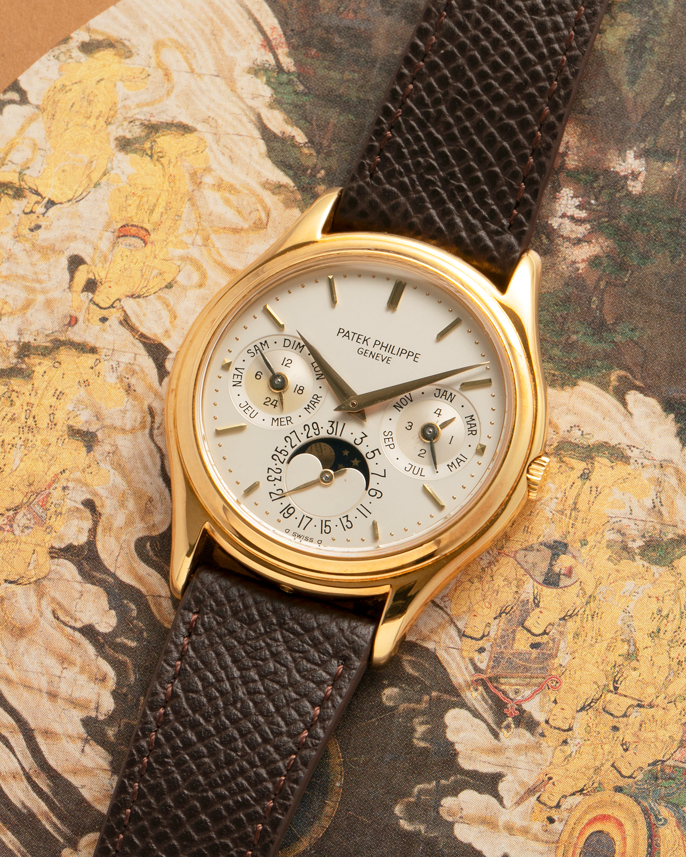 Brand: Patek Philippe
Year: 1989
Model: Perpetual Calendar ‘2nd Series’
Reference Number: 3940J
Material: 18-carat Yellow Gold
Movement: Patek Philippe Cal. 240Q, Self-Winding Micro-Rotor
Case Dimensions: 36mm x 8.5mm (Lug-to-Lug 43.3mm)
Lug Width: 18mm
Strap: Sotheby’s Dark Brown Textured Calf Leather Strap with Signed 18-carat Yellow Gold Tang Buckle
