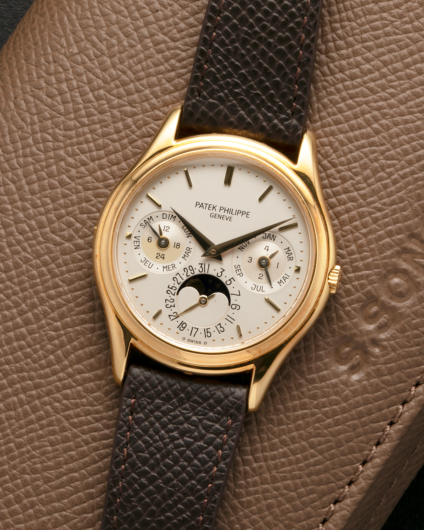 Brand: Patek Philippe
Year: 1989
Model: Perpetual Calendar ‘2nd Series’
Reference Number: 3940J
Material: 18-carat Yellow Gold
Movement: Patek Philippe Cal. 240Q, Self-Winding Micro-Rotor
Case Dimensions: 36mm x 8.5mm (Lug-to-Lug 43.3mm)
Lug Width: 18mm
Strap: Sotheby’s Dark Brown Textured Calf Leather Strap with Signed 18-carat Yellow Gold Tang Buckle
