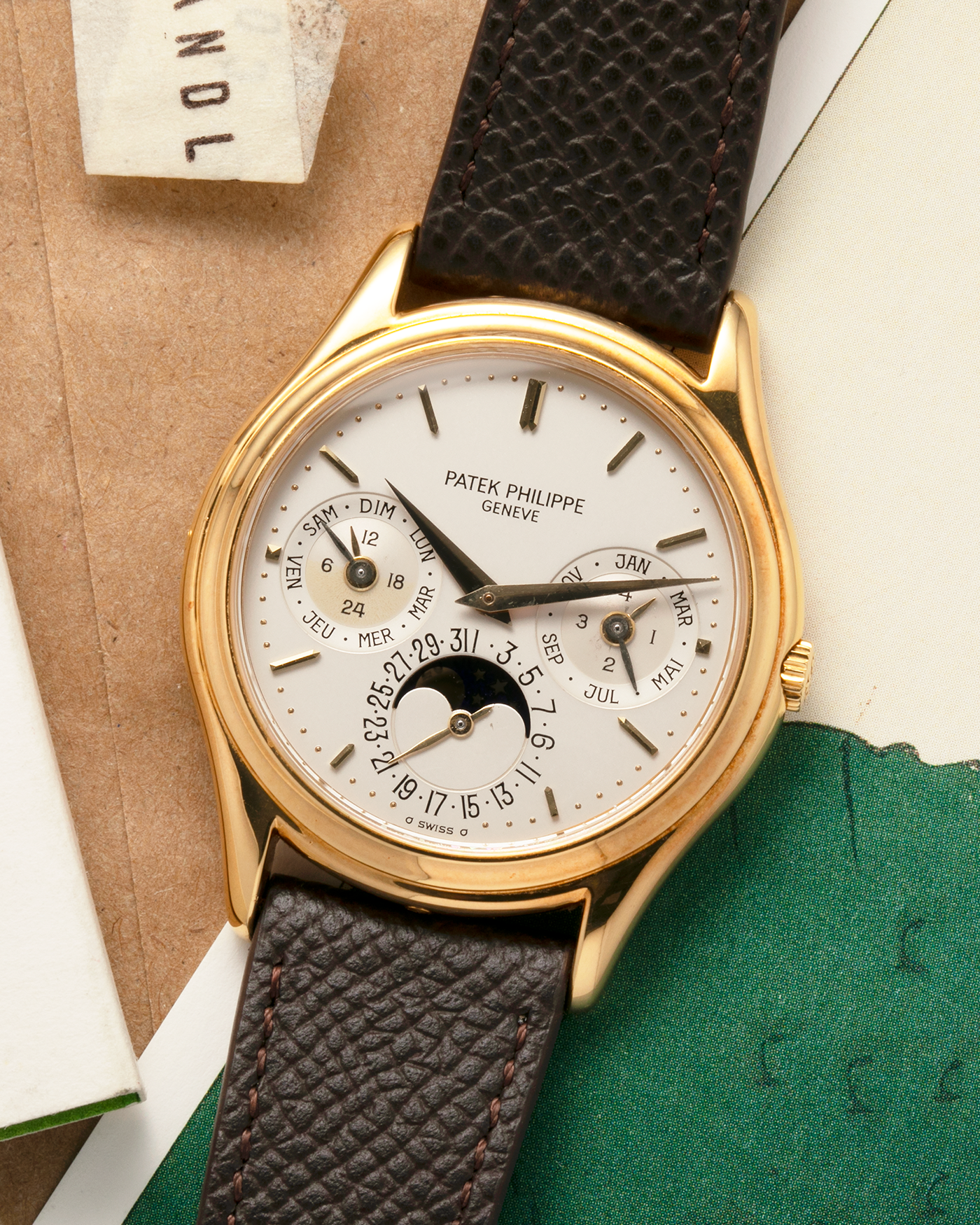 Brand: Patek Philippe
Year: 1989
Model: Perpetual Calendar ‘2nd Series’
Reference Number: 3940J
Material: 18-carat Yellow Gold
Movement: Patek Philippe Cal. 240Q, Self-Winding Micro-Rotor
Case Dimensions: 36mm x 8.5mm (Lug-to-Lug 43.3mm)
Lug Width: 18mm
Strap: Sotheby’s Dark Brown Textured Calf Leather Strap with Signed 18-carat Yellow Gold Tang Buckle