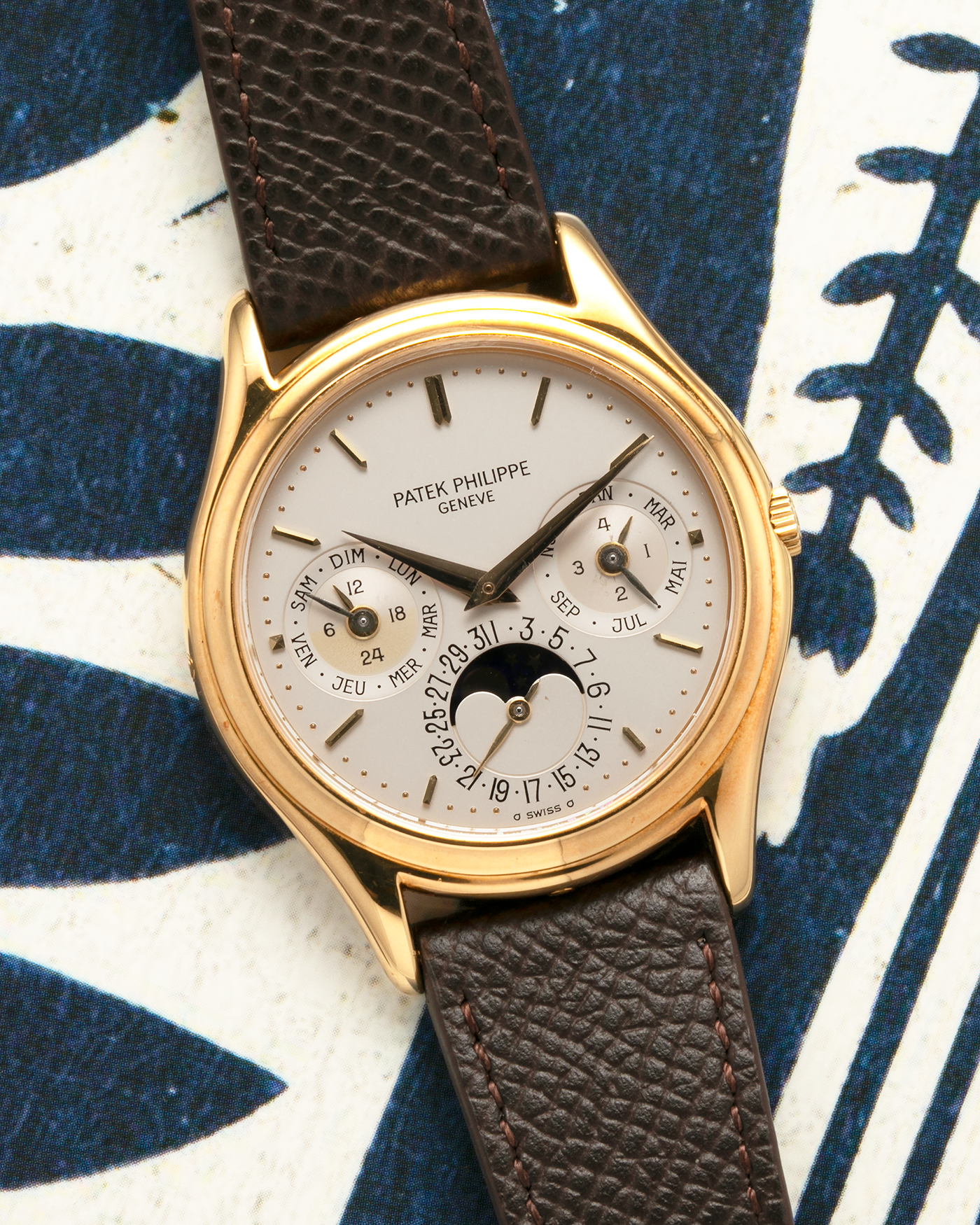 Brand: Patek Philippe
Year: 1989
Model: Perpetual Calendar ‘2nd Series’
Reference Number: 3940J
Material: 18-carat Yellow Gold
Movement: Patek Philippe Cal. 240Q, Self-Winding Micro-Rotor
Case Dimensions: 36mm x 8.5mm (Lug-to-Lug 43.3mm)
Lug Width: 18mm
Strap: Sotheby’s Dark Brown Textured Calf Leather Strap with Signed 18-carat Yellow Gold Tang Buckle