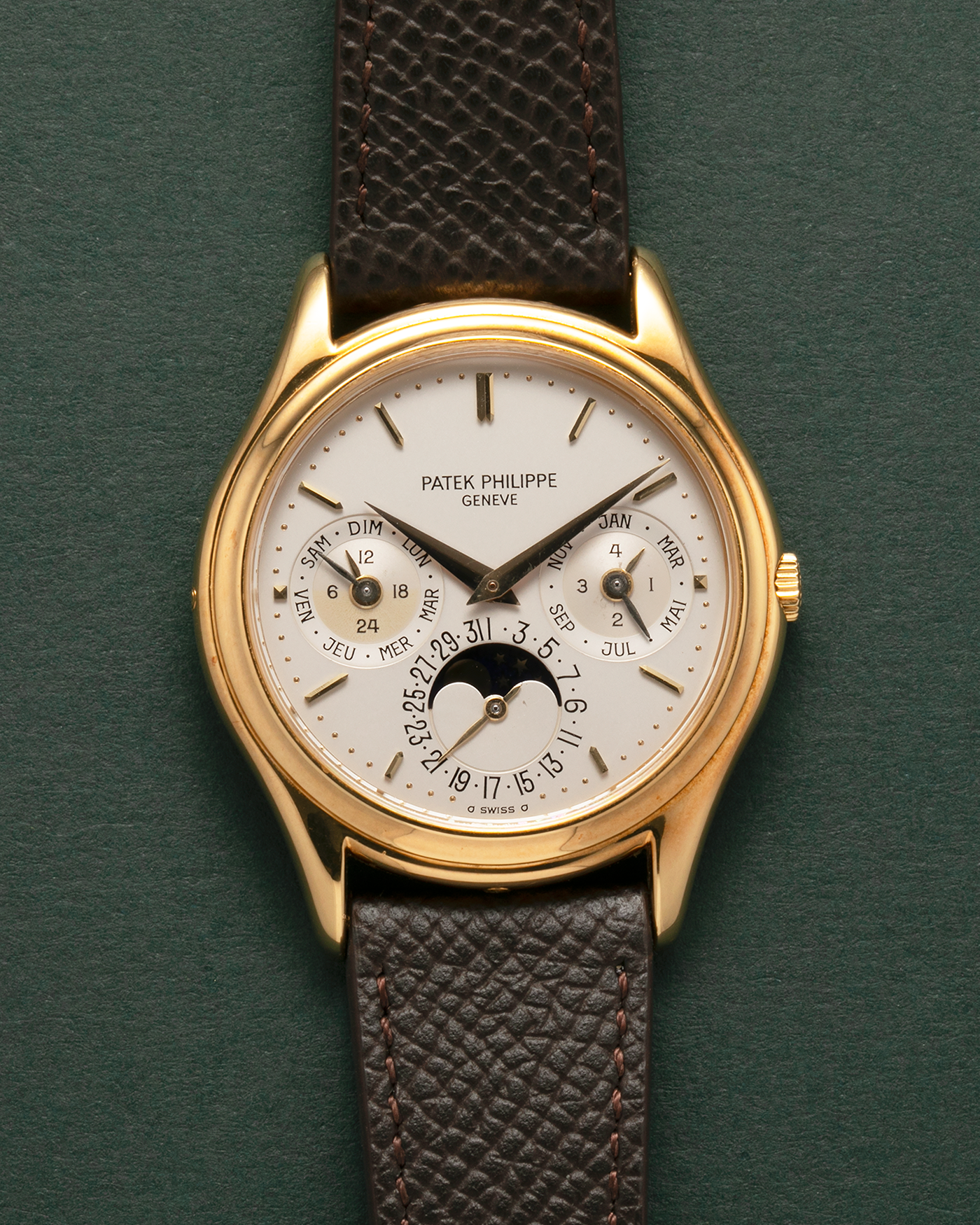 Brand: Patek Philippe
Year: 1989
Model: Perpetual Calendar ‘2nd Series’
Reference Number: 3940J
Material: 18-carat Yellow Gold
Movement: Patek Philippe Cal. 240Q, Self-Winding Micro-Rotor
Case Dimensions: 36mm x 8.5mm (Lug-to-Lug 43.3mm)
Lug Width: 18mm
Strap: Sotheby’s Dark Brown Textured Calf Leather Strap with Signed 18-carat Yellow Gold Tang Buckle