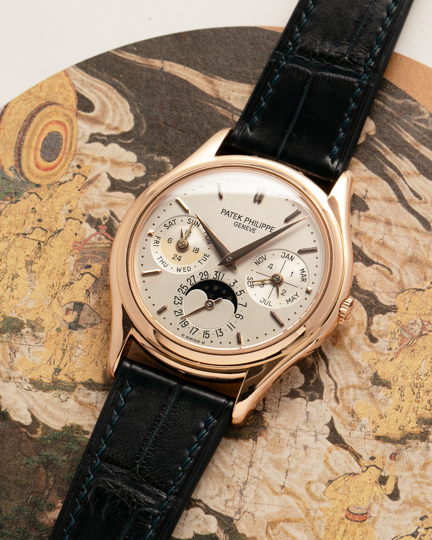 Brand: Patek Philippe
Year Manufactured: 1995
Year Sold: 1996
Reference Number: 3940R
Material: 18k Rose Gold
Movement: Patek Philippe Cal. 240Q, Self-Winding Micro-Rotor
Case Dimensions: 36mm Diameter 8.5mm Thickness
Lug Width: 18mm
Strap: Dark Blue Handdn Alligator Strap with Patek Philippe 18k Rose Gold Tang Buckle and Additional Patek Philippe Black Alligator Leather Strap