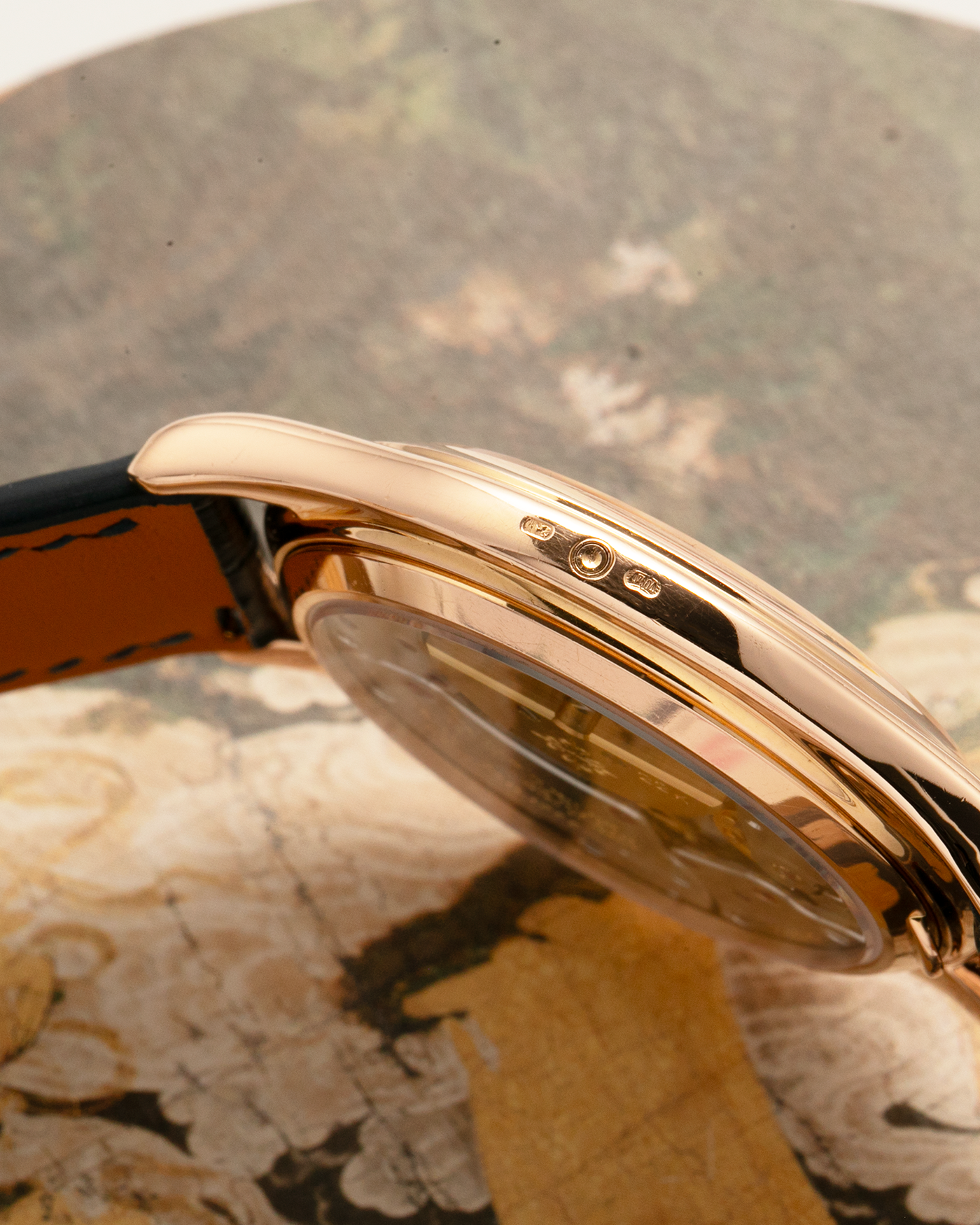 Brand: Patek Philippe
Year Manufactured: 1995
Year Sold: 1996
Reference Number: 3940R
Material: 18k Rose Gold
Movement: Patek Philippe Cal. 240Q, Self-Winding Micro-Rotor
Case Dimensions: 36mm Diameter 8.5mm Thickness
Lug Width: 18mm
Strap: Dark Blue Handdn Alligator Strap with Patek Philippe 18k Rose Gold Tang Buckle and Additional Patek Philippe Black Alligator Leather Strap