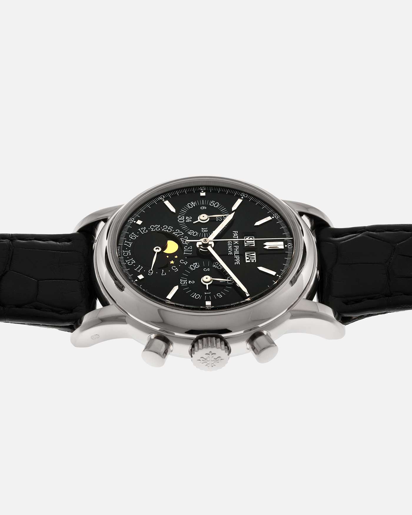 Brand: Patek Philippe
Year: 1995
Model: Perpetual Calendar Chronograph ‘4th Series’
Reference Number: 3970EG
Material: 18-carat White Gold
Movement: Patek Philippe Cal. 27-70 Q (Based on Lemania Cal. 2310), Self-Winding
Movement Number: 3045XXX
Case Dimensions: 36mm x 13mm (43.3mm Lug-to-Lug)
Lug Width: 19mm
Strap: Patek Philippe Black Alligator Leather Strap with Signed 18-carat White Gold Deployant Clasp