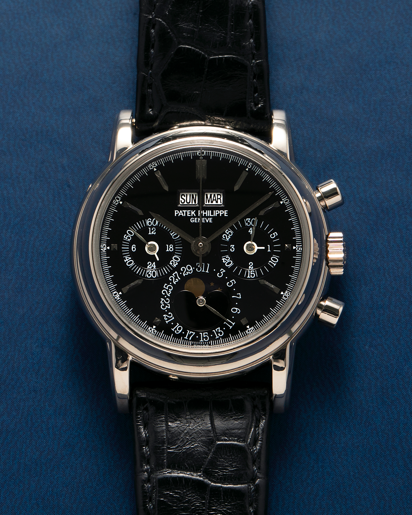 Brand: Patek Philippe
Year: 1995
Model: Perpetual Calendar Chronograph ‘4th Series’
Reference Number: 3970EG
Material: 18-carat White Gold
Movement: Patek Philippe Cal. 27-70 Q (Based on Lemania Cal. 2310), Self-Winding
Movement Number: 3045XXX
Case Dimensions: 36mm x 13mm (43.3mm Lug-to-Lug)
Lug Width: 19mm
Strap: Patek Philippe Black Alligator Leather Strap with Signed 18-carat White Gold Deployant Clasp