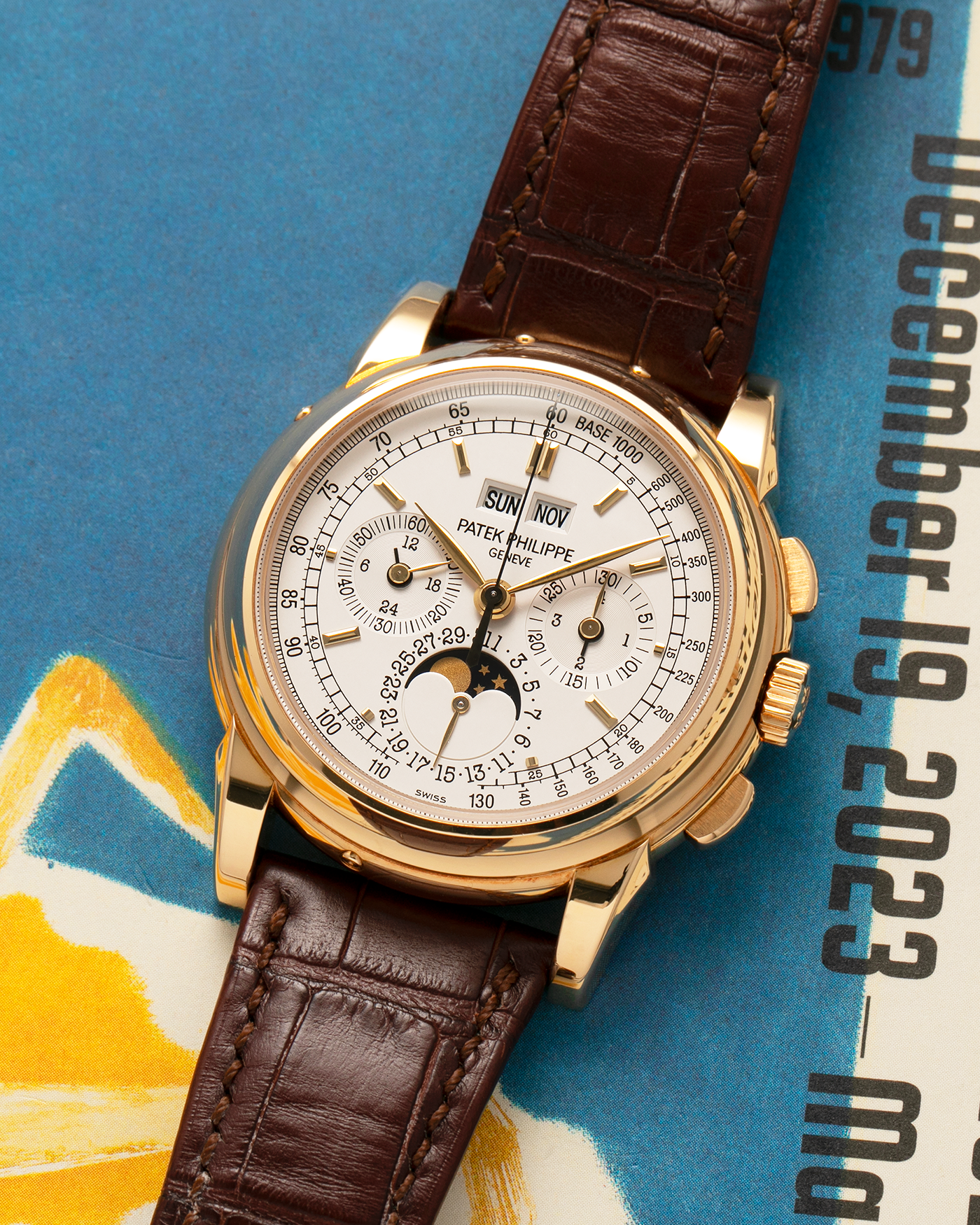 Brand: Patek Philippe
Year: 2008
Model: Perpetual Calendar Chronograph
Reference Number: 5970J
Material: 18-carat Yellow Gold
Movement: Patek Philippe Cal. 27-70 Q (Based on Lemania Cal. 2310), Manual-Winding
Case Dimensions: 40mm x 13.5mm (Lug-to-Lug 46.5mm)
Lug Width: 21mm
Strap: Patek Philippe Dark Brown Alligator Leather Strap with Signed 18-carat Yellow Gold Deployant Clasp