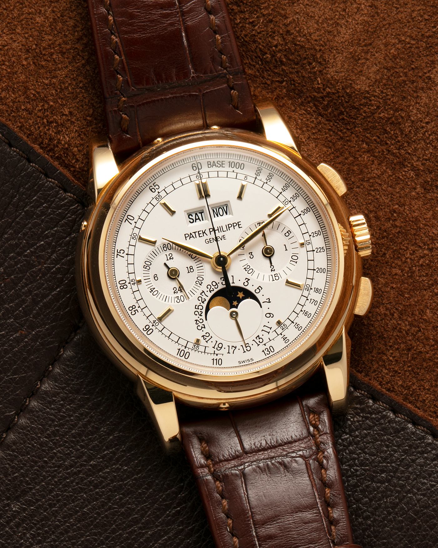Brand: Patek Philippe
Year: 2008
Model: Perpetual Calendar Chronograph
Reference Number: 5970J
Material: 18-carat Yellow Gold
Movement: Patek Philippe Cal. 27-70 Q (Based on Lemania Cal. 2310), Manual-Winding
Case Dimensions: 40mm x 13.5mm (Lug-to-Lug 46.5mm)
Lug Width: 21mm
Strap: Patek Philippe Dark Brown Alligator Leather Strap with Signed 18-carat Yellow Gold Deployant Clasp