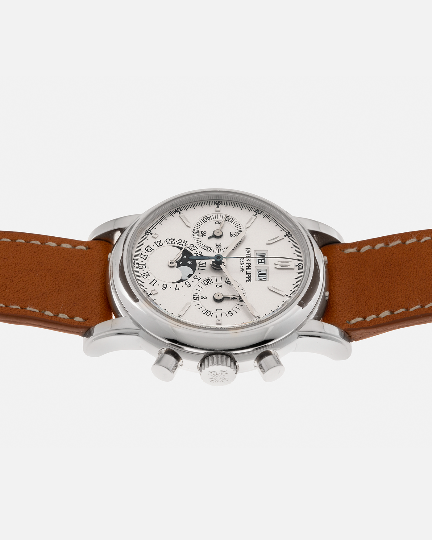 Brand: Patek Philippe
Year: 2004
Model: Perpetual Calendar Chronograph
Reference Number: 3970EP
Material: Platinum 950
Movement: Patek Philippe Cal. 27-70 Q (Based on Lemania Cal. 2310), Self-Winding
Movement Number: 3047XXX
Case Dimensions: 36mm x 13mm (43.3mm Lug-to-Lug)
Lug Width: 19mm
Strap: Wind Vintage Tanned Calfskin Leather Strap with Signed Platinum 950 Tang Buckle, with additional Patek Philippe Dark Brown Calf Leather Strap and Signed Platinum 950 Deployant Clasp