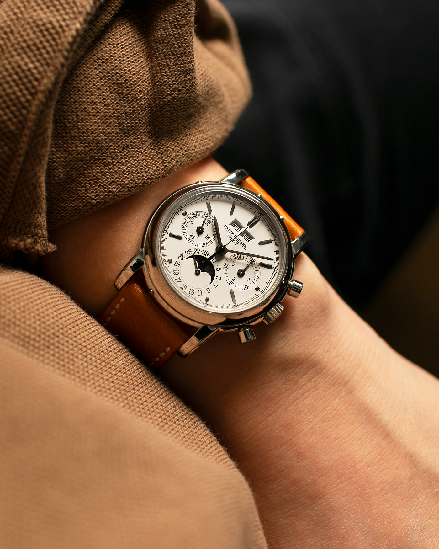 Brand: Patek Philippe
Year: 2004
Model: Perpetual Calendar Chronograph
Reference Number: 3970EP
Material: Platinum 950
Movement: Patek Philippe Cal. 27-70 Q (Based on Lemania Cal. 2310), Self-Winding
Movement Number: 3047XXX
Case Dimensions: 36mm x 13mm (43.3mm Lug-to-Lug)
Lug Width: 19mm
Strap: Wind Vintage Tanned Calfskin Leather Strap with Signed Platinum 950 Tang Buckle, with additional Patek Philippe Dark Brown Calf Leather Strap and Signed Platinum 950 Deployant Clasp