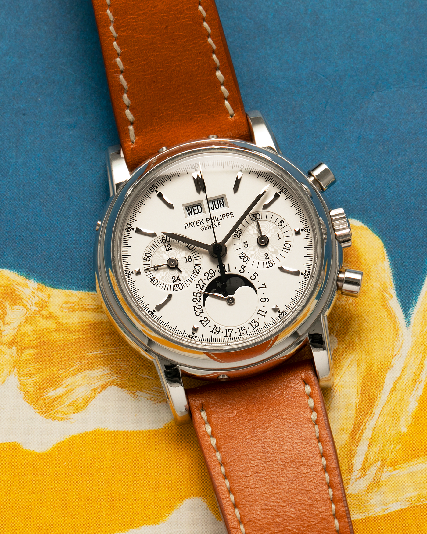 Brand: Patek Philippe
Year: 2004
Model: Perpetual Calendar Chronograph
Reference Number: 3970EP
Material: Platinum 950
Movement: Patek Philippe Cal. 27-70 Q (Based on Lemania Cal. 2310), Self-Winding
Movement Number: 3047XXX
Case Dimensions: 36mm x 13mm (43.3mm Lug-to-Lug)
Lug Width: 19mm
Strap: Wind Vintage Tanned Calfskin Leather Strap with Signed Platinum 950 Tang Buckle, with additional Patek Philippe Dark Brown Calf Leather Strap and Signed Platinum 950 Deployant Clasp