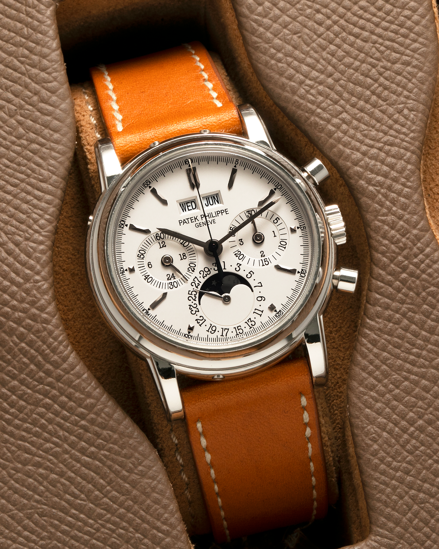 Brand: Patek Philippe
Year: 2004
Model: Perpetual Calendar Chronograph
Reference Number: 3970EP
Material: Platinum 950
Movement: Patek Philippe Cal. 27-70 Q (Based on Lemania Cal. 2310), Self-Winding
Movement Number: 3047XXX
Case Dimensions: 36mm x 13mm (43.3mm Lug-to-Lug)
Lug Width: 19mm
Strap: Wind Vintage Tanned Calfskin Leather Strap with Signed Platinum 950 Tang Buckle, with additional Patek Philippe Dark Brown Calf Leather Strap and Signed Platinum 950 Deployant Clasp