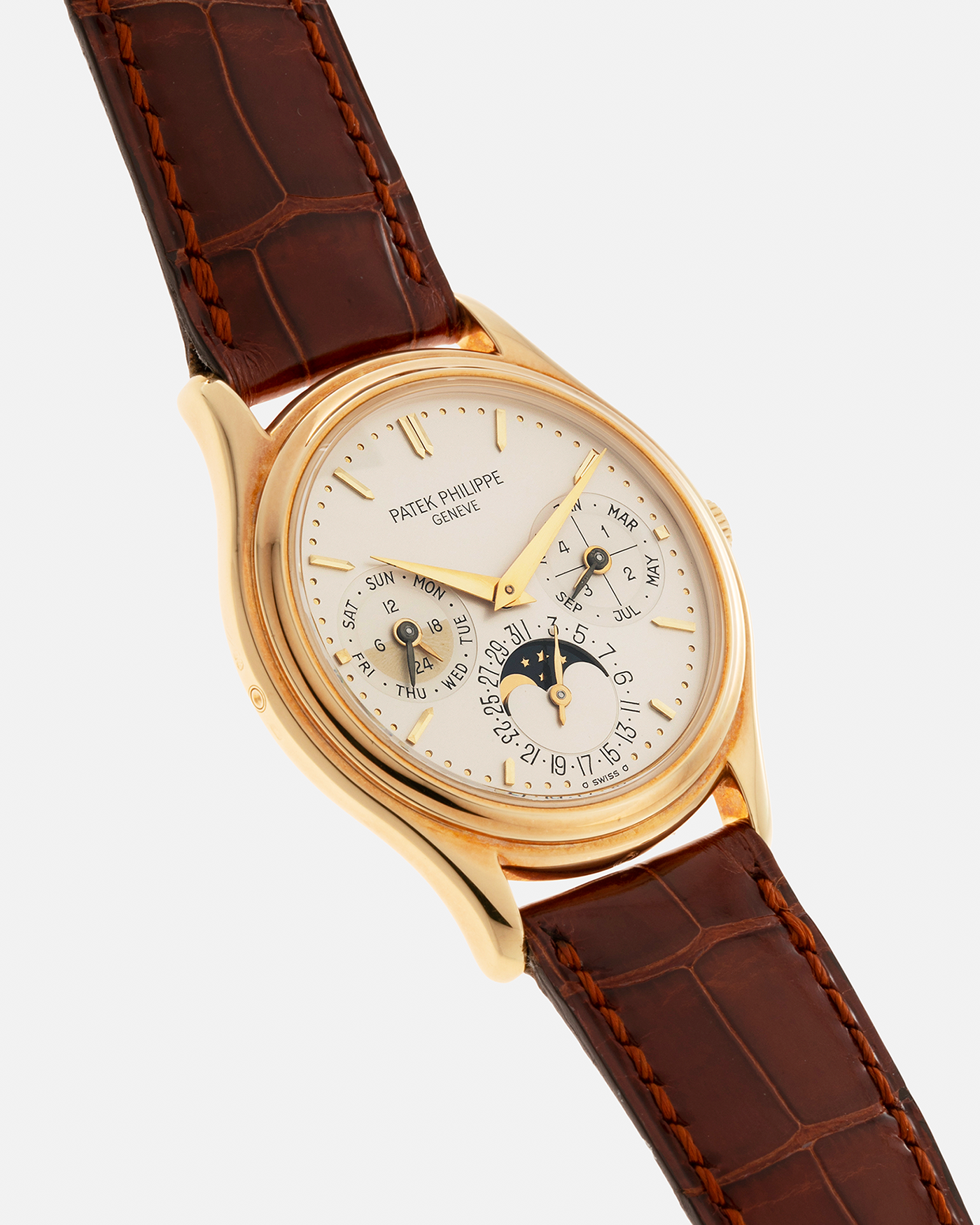 Brand: Patek Philippe Year: 1990’s Model: Perpetual Calendar Reference Number: 3940J Material: 18-carat Yellow Gold Movement: Patek Philippe Cal. 240Q, Self-Winding Micro-Rotor Case Diameter: 36mm Strap: Patek Philippe Chestnut Brown Alligator Strap with Signed 18-carat Yellow Gold Tang Buckle