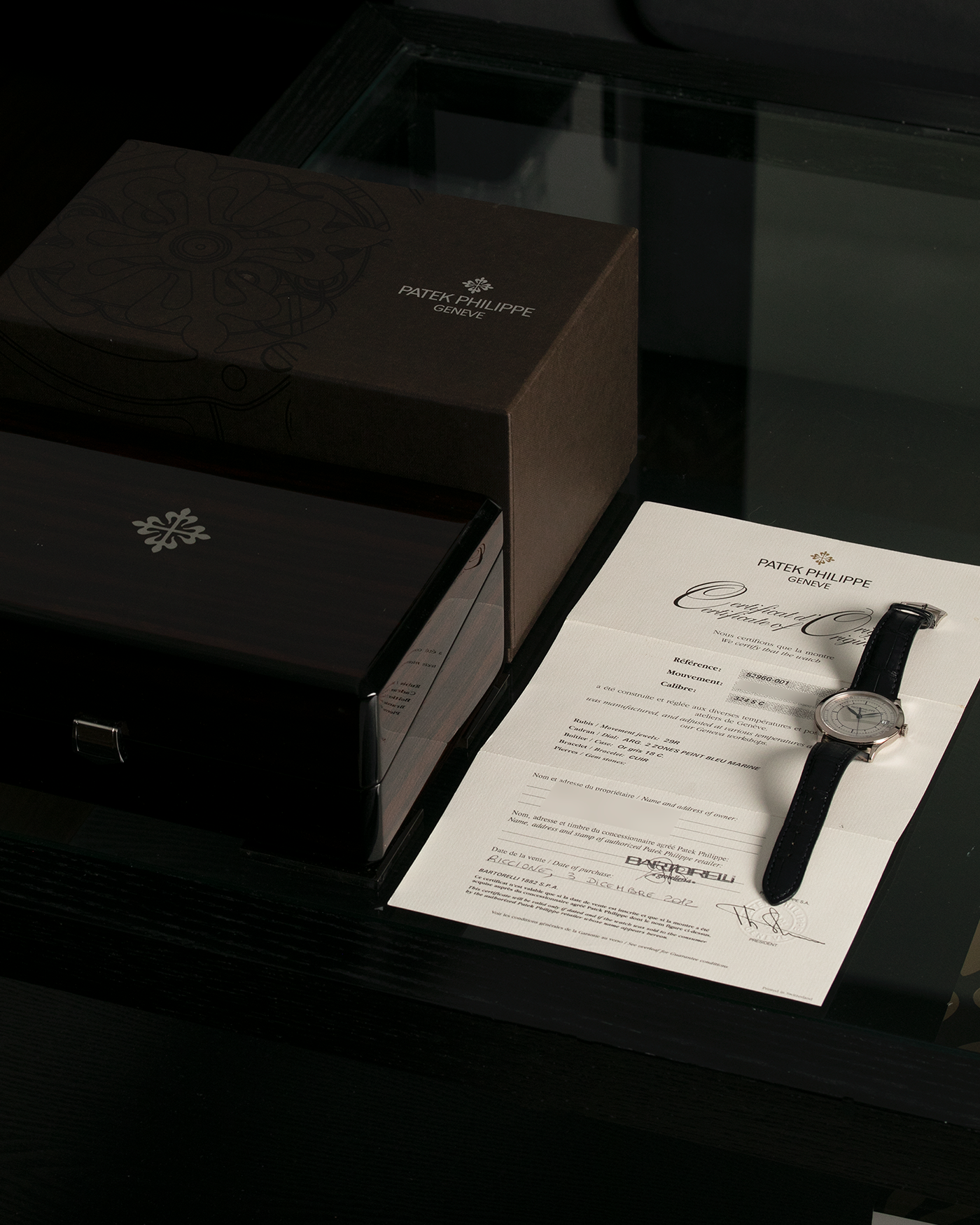 Brand: Patek Philippe Year: 2012 Model: Calatrava Reference: 5296G-001 Material: 18-carat White Gold Movement: Patek Philippe Cal. 324 S C, Self-Winding Case Diameter: 38mm Strap: Patek Philippe Dark Navy Alligator Strap with Signed 18-carat White Gold Tang Buckle