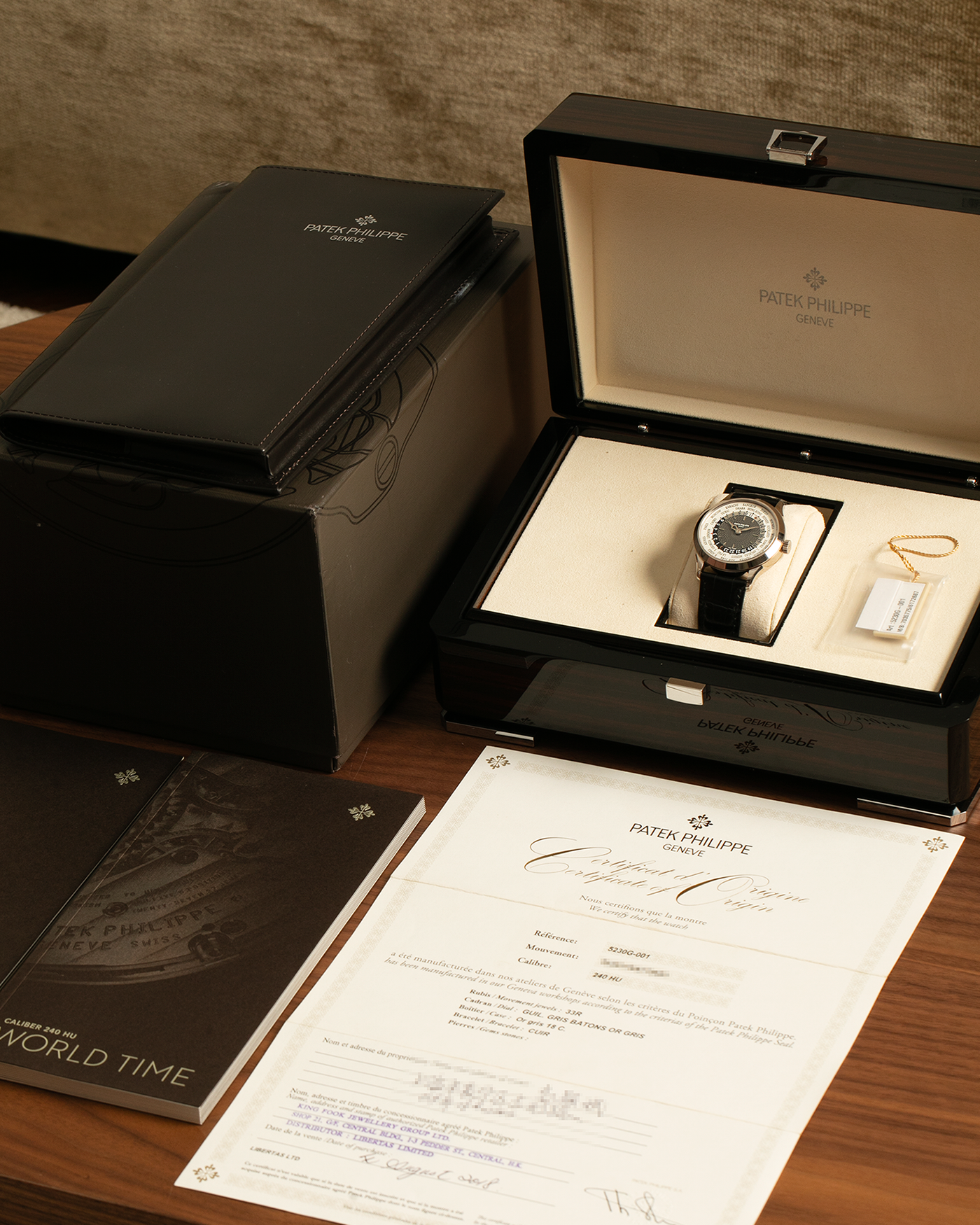 Brand: Patek Philippe
Year: 2018
Model: World Time
Reference: 5230G
Material: 18-carat White Gold
Movement: Patek Philippe Cal. 240 HU Micro Rotor, Self-Winding
Case Dimensions: 38.5mm x 10.3mm (Lug-to-Lug 47mm)
Lug Width: 20mm
Strap: Patek Philippe Black Alligator Leather Strap with Signed 18-carat White Gold Deployant Clasp