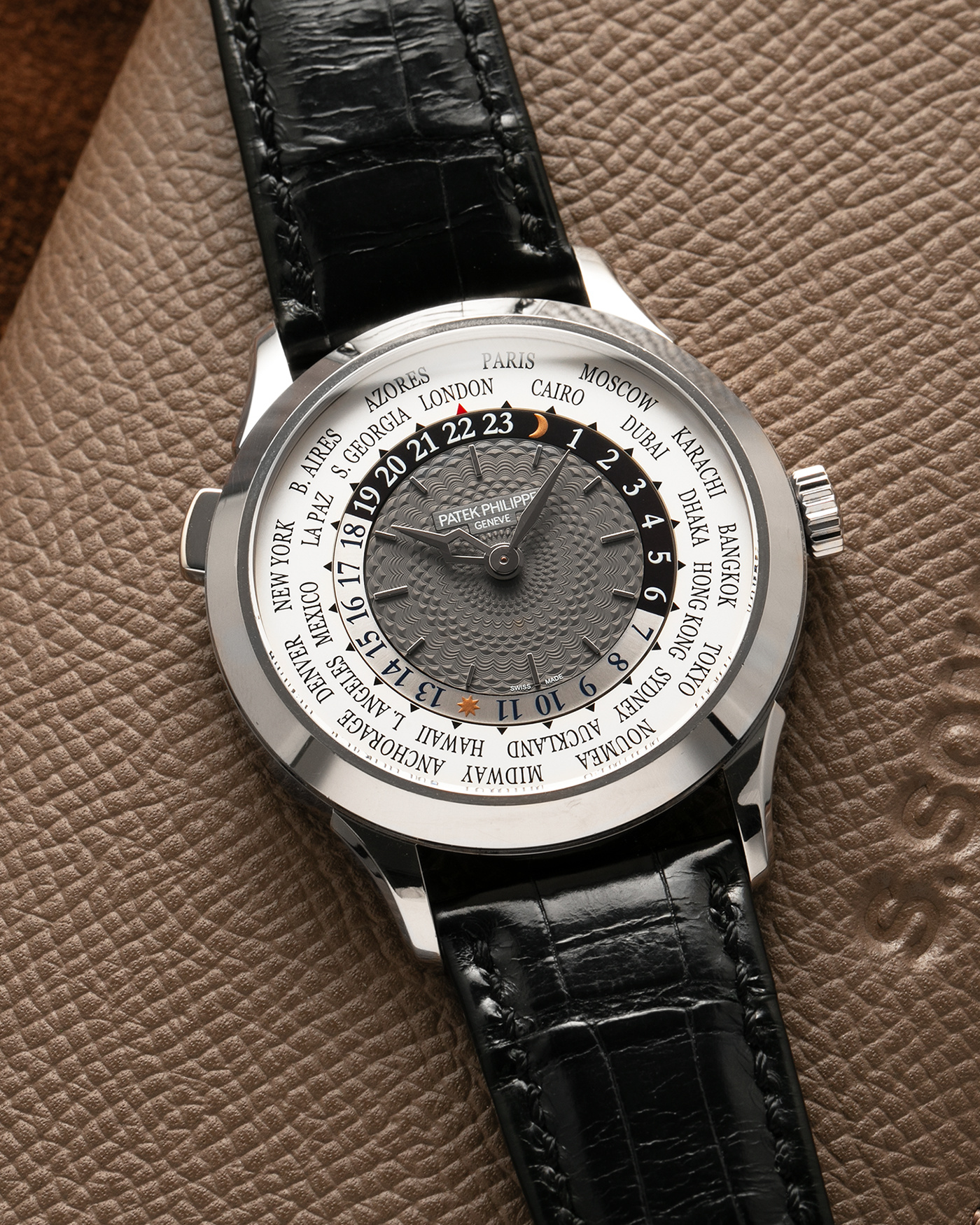 Brand: Patek Philippe
Year: 2018
Model: World Time
Reference: 5230G
Material: 18-carat White Gold
Movement: Patek Philippe Cal. 240 HU Micro Rotor, Self-Winding
Case Dimensions: 38.5mm x 10.3mm (Lug-to-Lug 47mm)
Lug Width: 20mm
Strap: Patek Philippe Black Alligator Leather Strap with Signed 18-carat White Gold Deployant Clasp