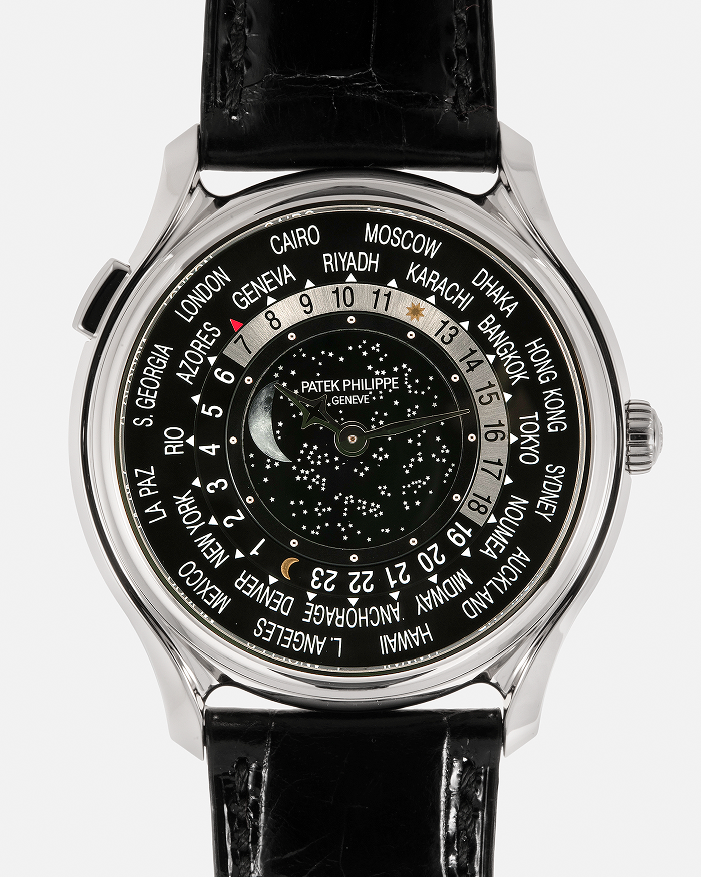 Brand: Patek Philippe Year: 2015 Model: World Time Moon, Limited Edition of 1300 pieces Reference Number: 5575G Material: 18-carat White Gold Movement: Patek Philippe Cal. 240 HU LU Micro-Rotor, Self-Winding Case Diameter: 40mm Lug Width: 20mm Strap: Patek Philippe Black Alligator Leather Strap with Signed / Engraved 18-carat White Gold Deployant Clasp