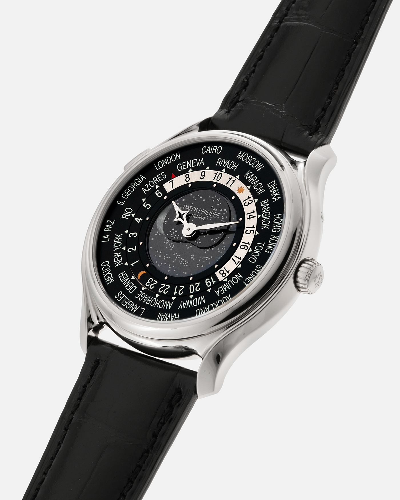 Brand: Patek Philippe Year: 2015 Model: World Time Moon, Limited Edition of 1300 pieces Reference Number: 5575G Material: 18-carat White Gold Movement: Patek Philippe Cal. 240 HU LU Micro-Rotor, Self-Winding Case Diameter: 40mm Lug Width: 20mm Strap: Patek Philippe Black Alligator Leather Strap with Signed / Engraved 18-carat White Gold Deployant Clasp