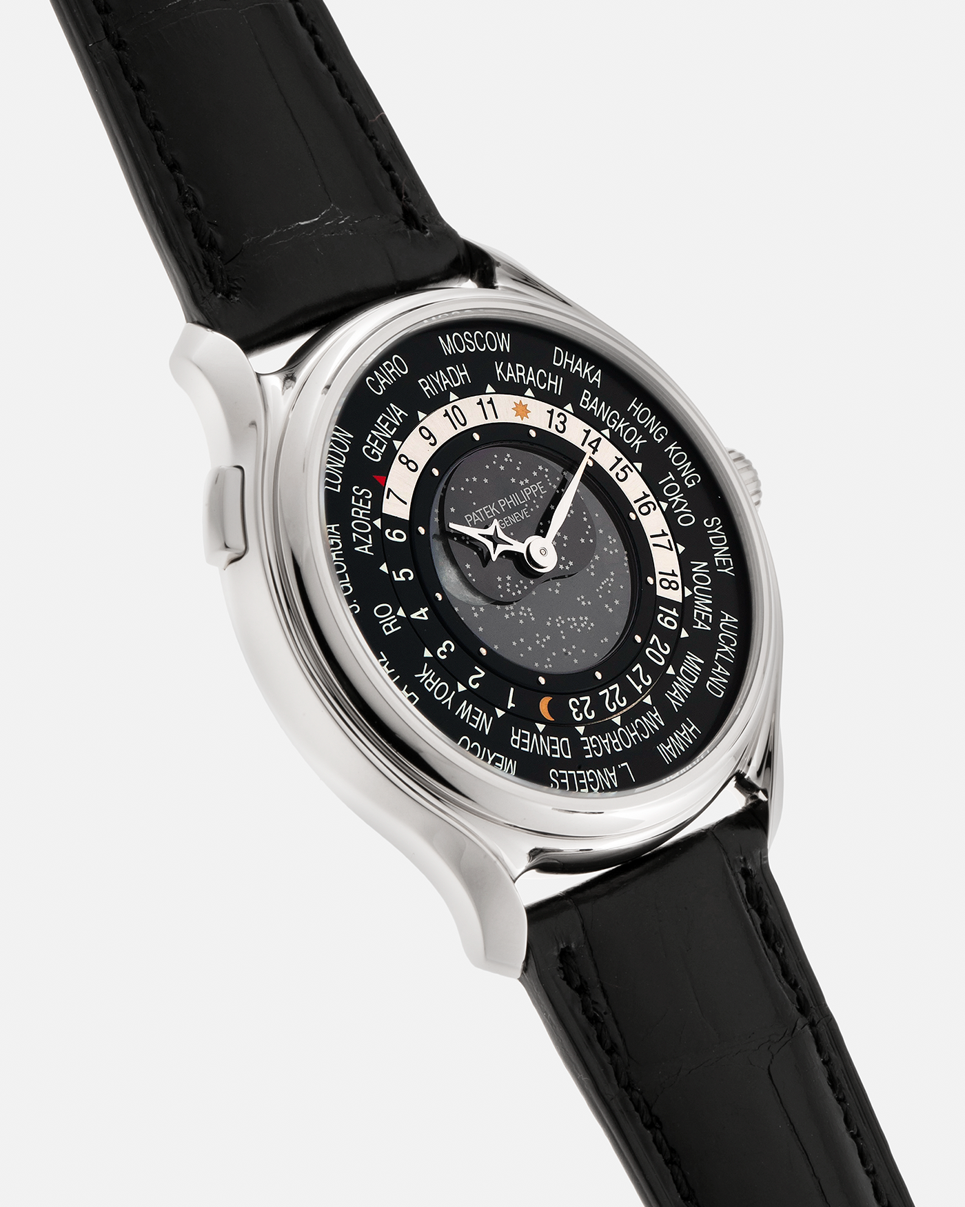 Brand: Patek Philippe Year: 2015 Model: World Time Moon, Limited Edition of 1300 pieces Reference Number: 5575G Material: 18-carat White Gold Movement: Patek Philippe Cal. 240 HU LU Micro-Rotor, Self-Winding Case Diameter: 40mm Lug Width: 20mm Strap: Patek Philippe Black Alligator Leather Strap with Signed / Engraved 18-carat White Gold Deployant Clasp