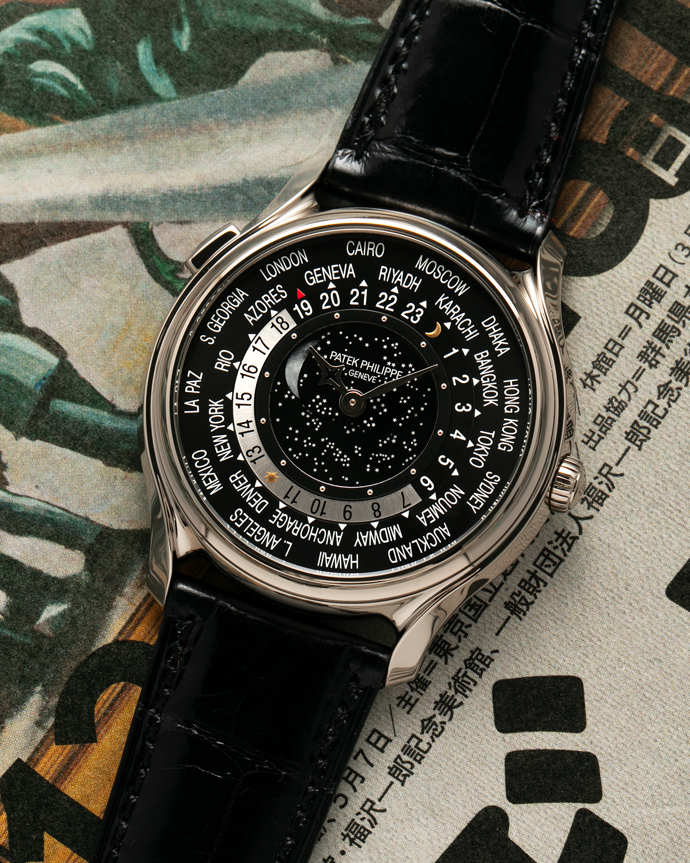 Brand: Patek Philippe Year: 2015 Model: World Time Moon, Limited Edition of 1300 pieces Reference Number: 5575G Material: 18-carat White Gold Movement: Patek Philippe Cal. 240 HU LU Micro-Rotor, Self-Winding Case Diameter: 40mm Lug Width: 20mm Strap: Patek Philippe Black Alligator Leather Strap with Signed / Engraved 18-carat White Gold Deployant Clasp