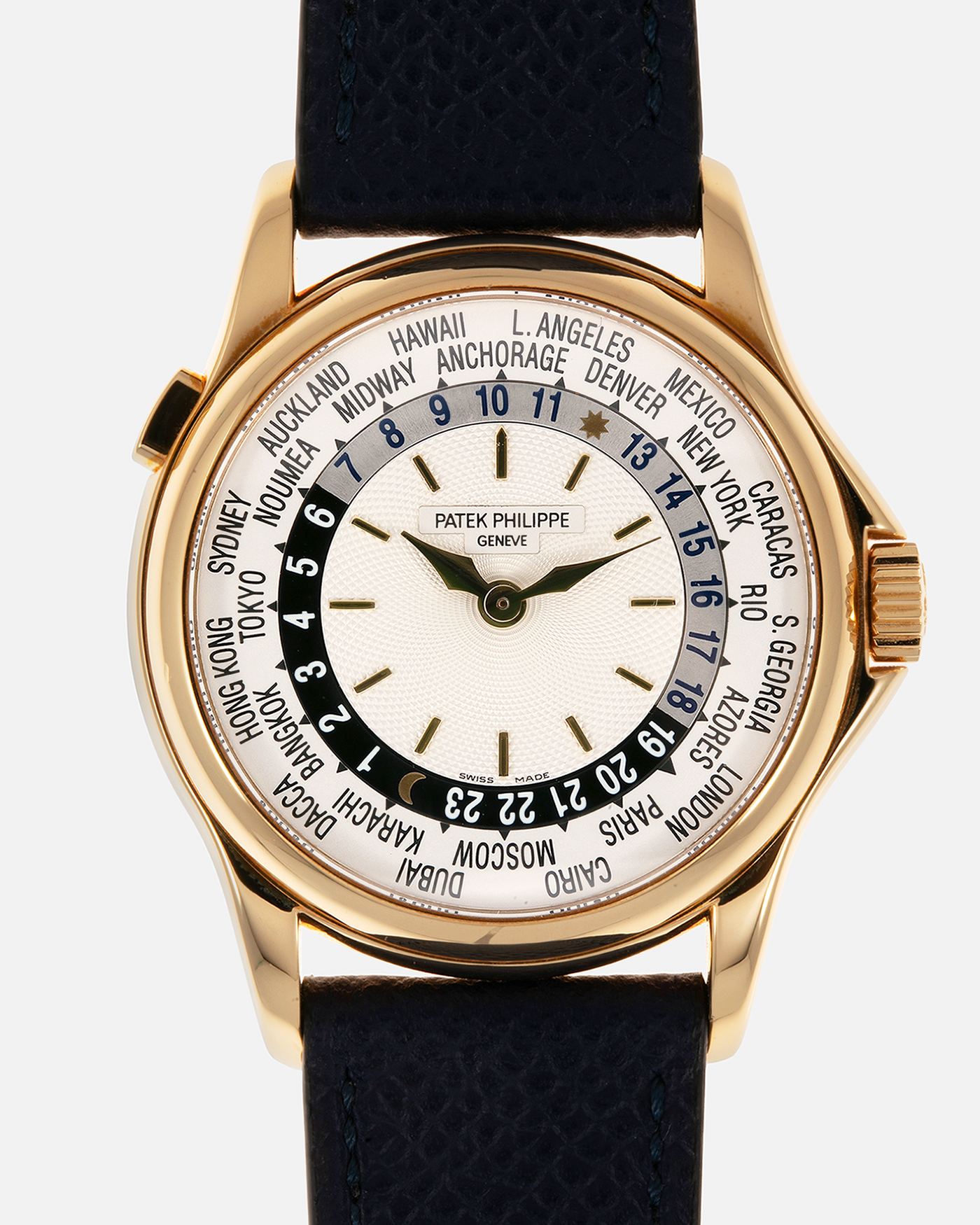 Brand: Patek Philippe Year: 2000s Model: World Time Reference Number: 5110J Material: 18-carat Yellow Gold Movement: Patek Philippe Cal. 240 HU Micro-Rotor, Self-Winding Case Diameter: 37mm Lug Width: 20mm Bracelet: Nostime Navy Blue Textured Calf Leather Strap with Signed 18-carat Yellow Gold Deployant Clasp, Patek Philippe Brown Alligator Leather Strap (Used)
